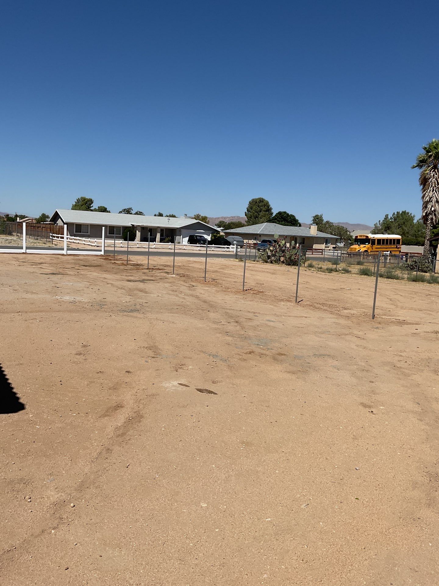 6ft White Privacy Vinyl Fence with Chain-link Fence by Fence Guys Inc.
