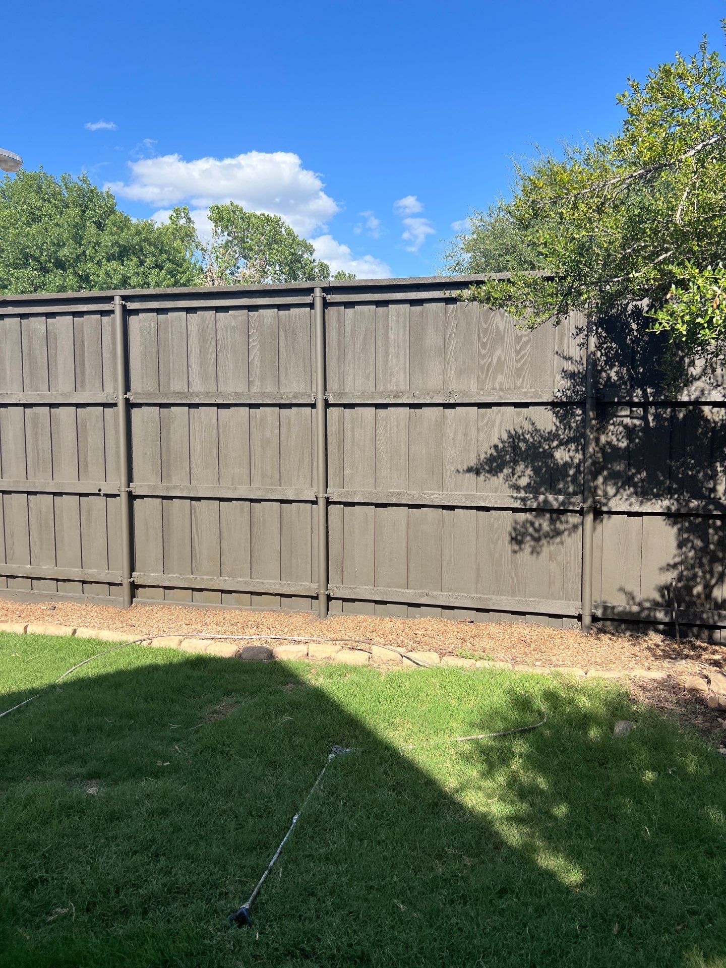 Fence Staining by Nomad Painting
