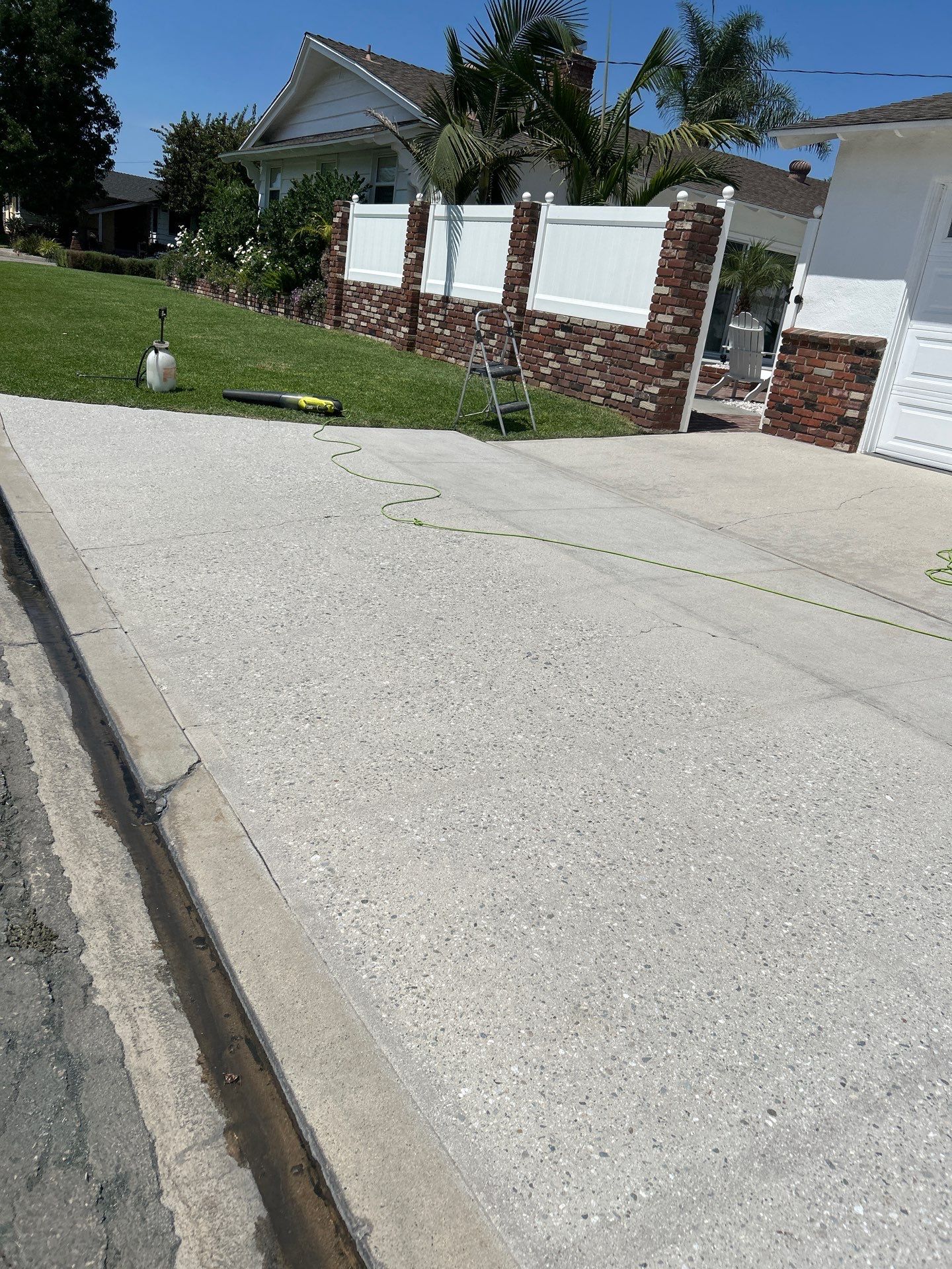 Sandblasting Paint Off Concrete Driveway In Downey, CA by La Power Washing Inc