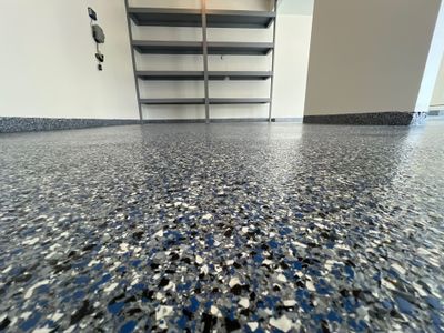 Custom Epoxy Flake Floor and Garage Wall Renovation in Ada