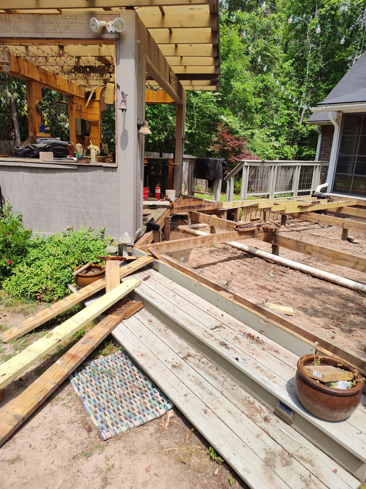 Patio in concrete with drainage improvements by Cornerstone Home Builders, LLC