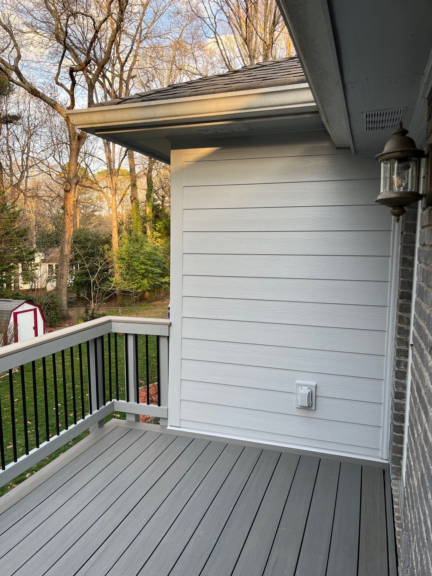 James Hardie Siding Replacement, Trex Railing Install, Exterior Painting, and Staining in Stone Mountain, GA by Nelson Exteriors 