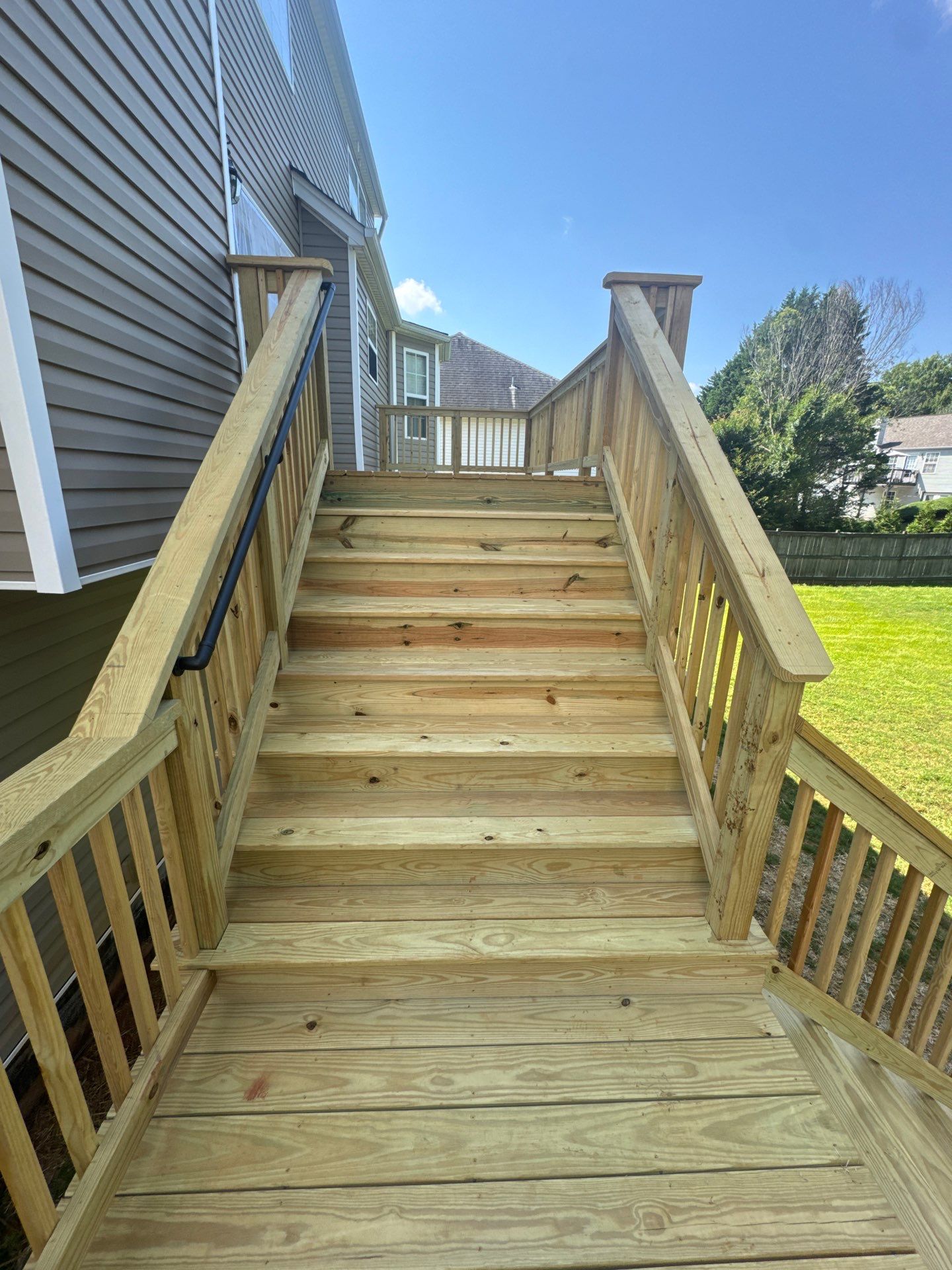 Backyard Deck Expansion & Custom Staircase Installation in Suwanee. by Swift Home Renovations