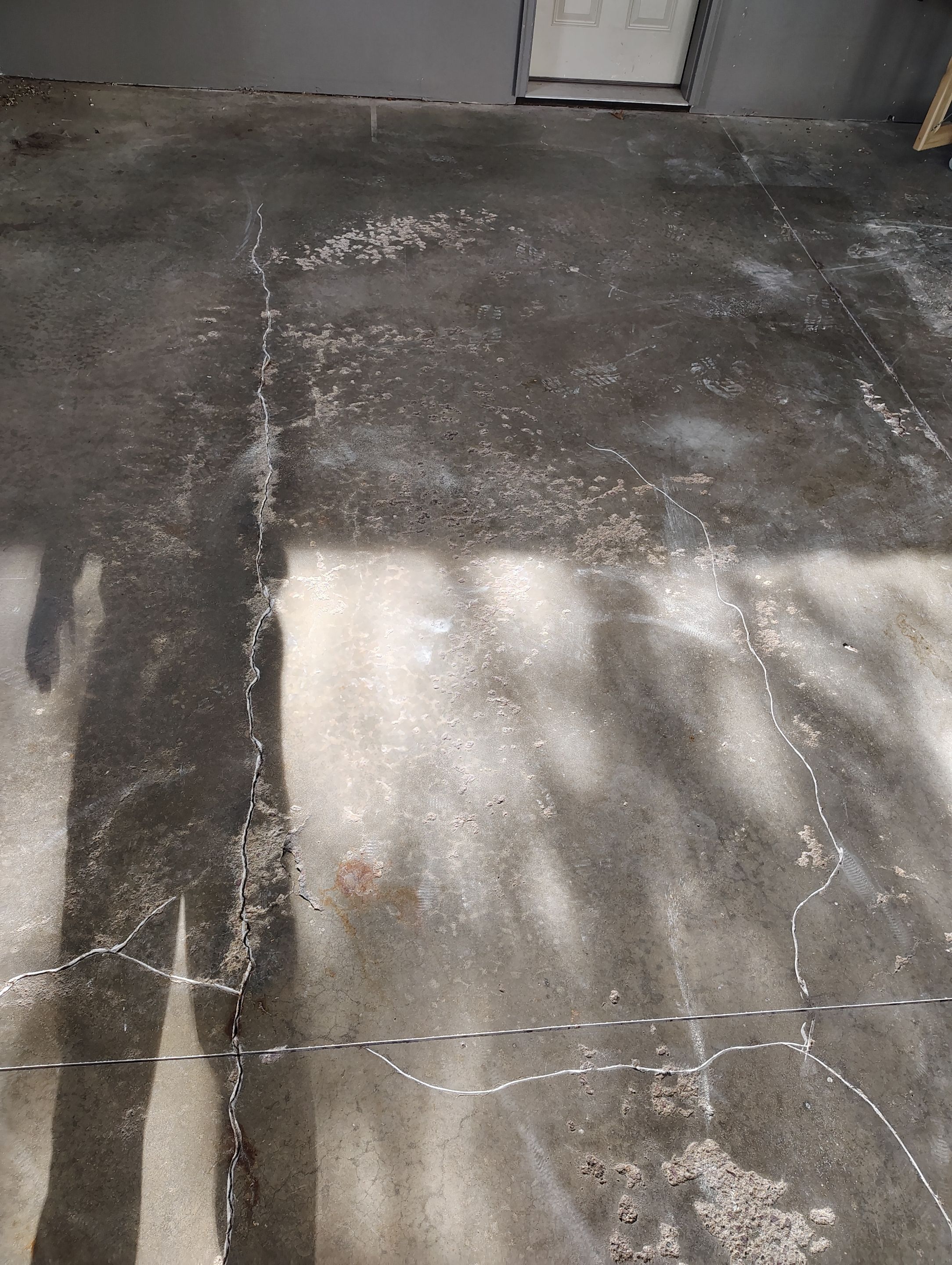 Garage Floor Concrete Coating and Crack Repair in Sioux Falls by Select Painting, Coatings & Garage Cabinets