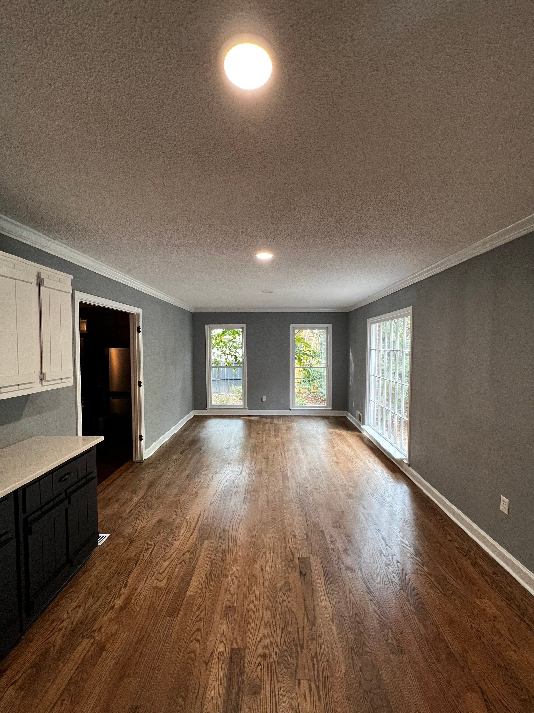 Kitchen and Living Area Renovation Featuring Hardwood Flooring in Smyrna by Swift Home Renovations