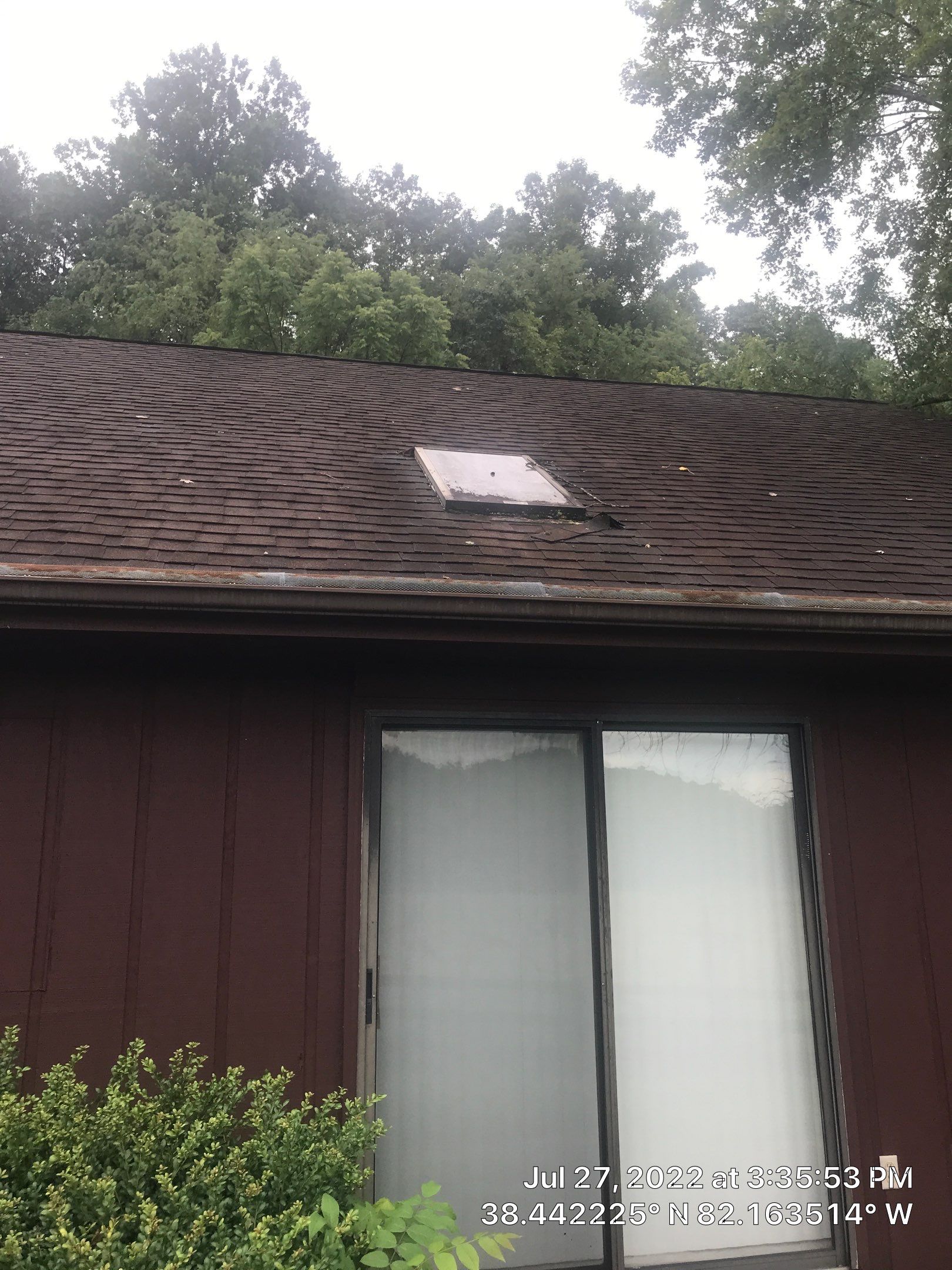 Shingle Roofing with Velux Skylight replacement and stone chimney flashing  by Secure Construction Company Inc