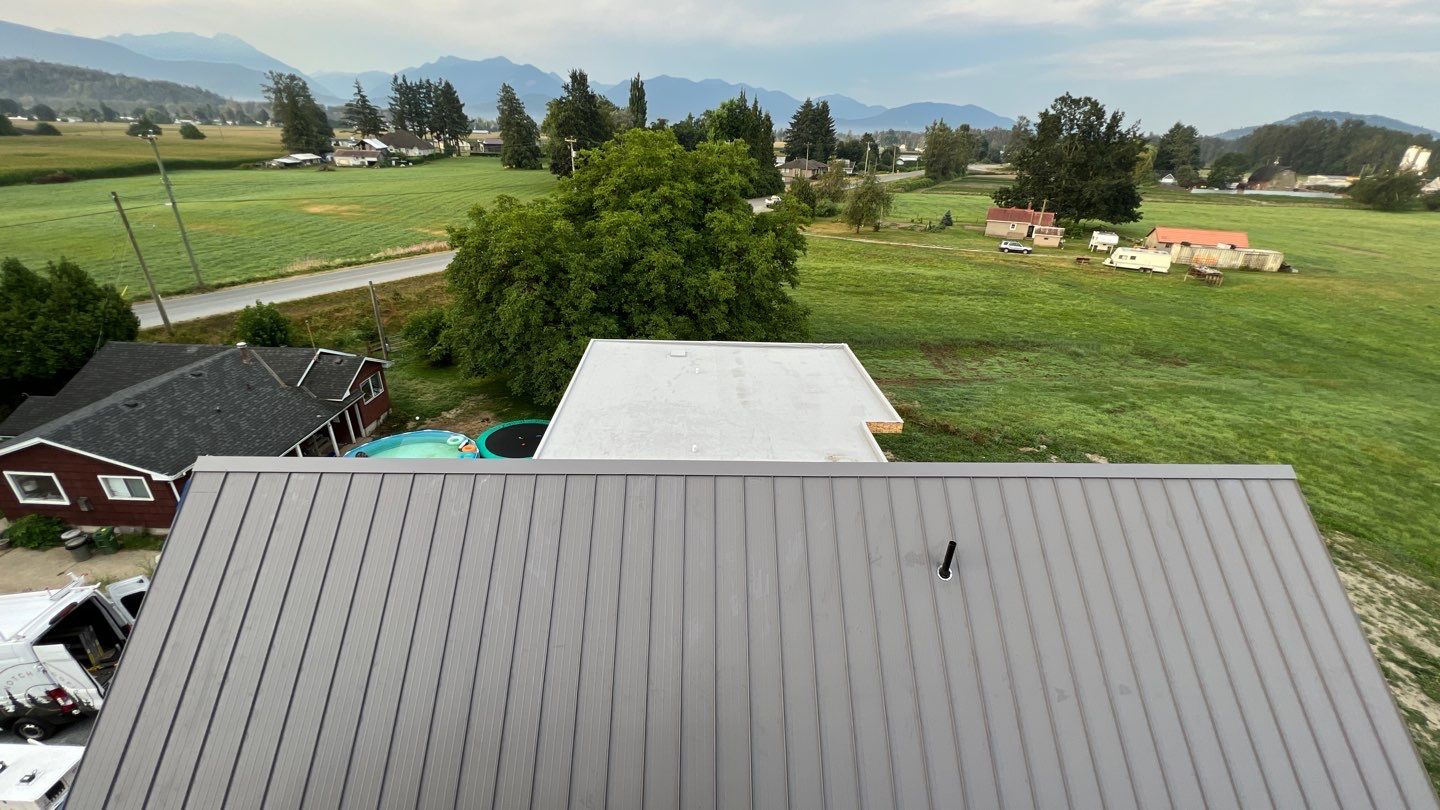 Residential Roofing Installation using multiple products by Top Notch Roofing Inc