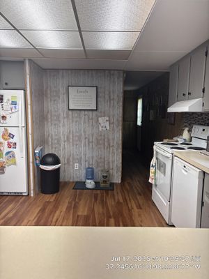 Attica Kitchen Remodel Featuring Gray Cabinets and Glass Tile Backsplash