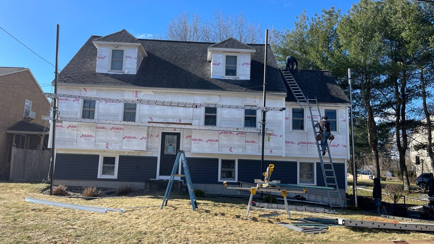 Complete Exterior Renovation with New Siding & Gutters   by Sensible Home Solutions