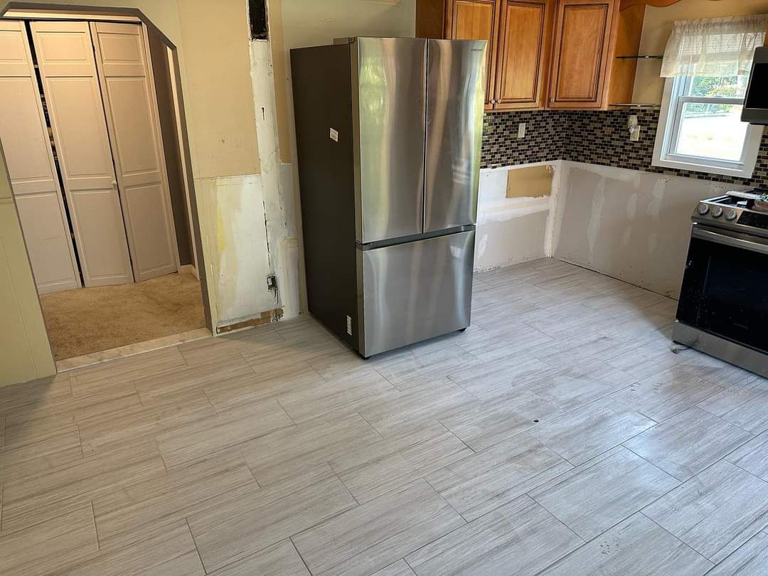 New Tile Kitchen Floor using Large Format Porceline Tile by Footprints Floors Morristown