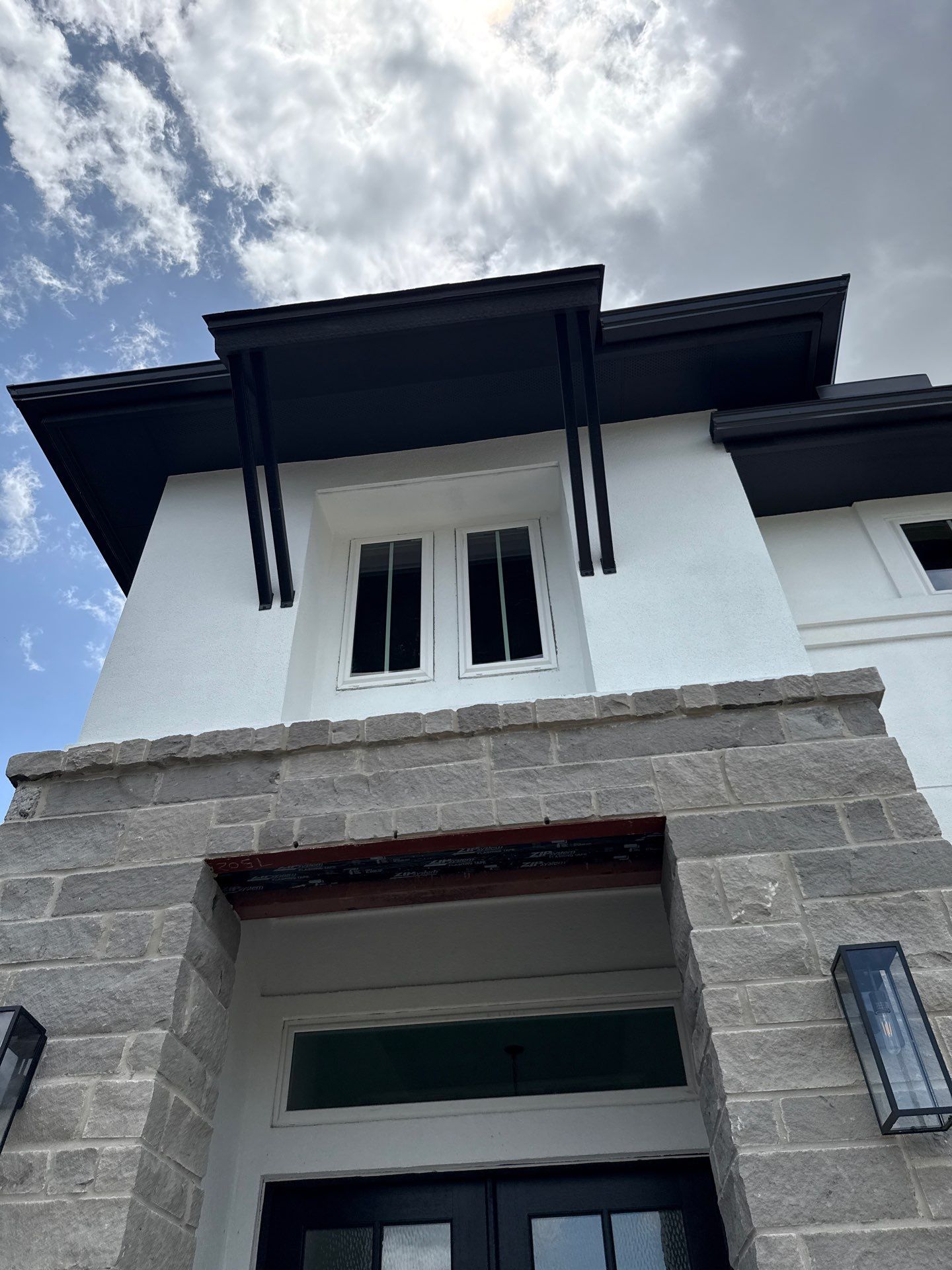 Waller Sophistication: Snowbound Color Stucco with Limestone Accents. by Apex Conventional Stucco Llc