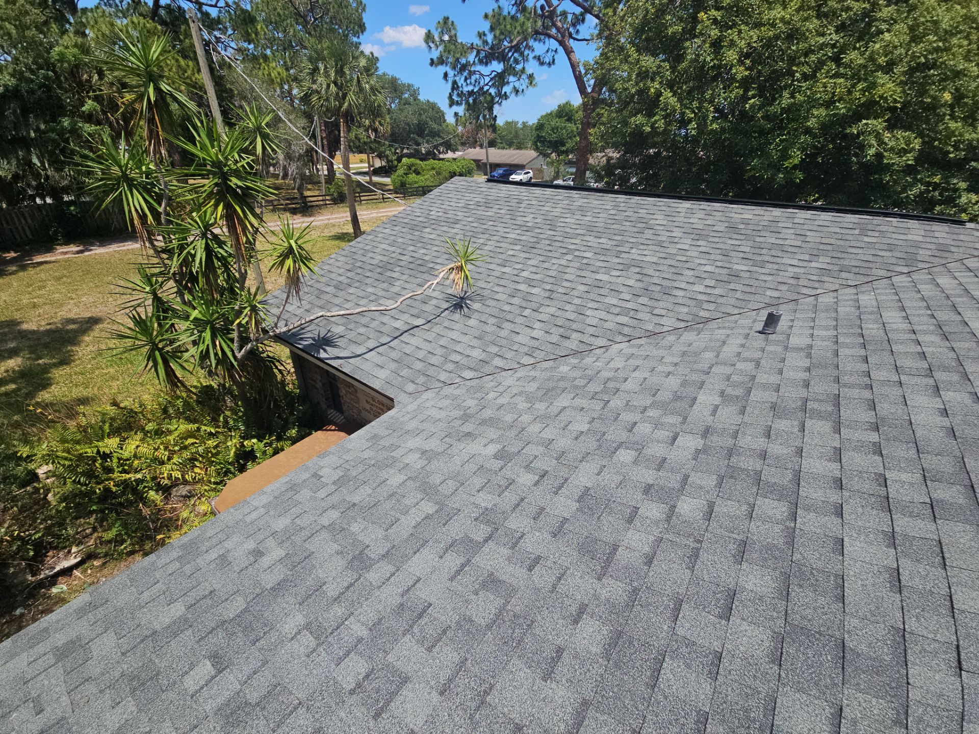 Roof Replacement with Architectural Shingles and Chimney Repair in Cocoa by Wiedmann Construction & Roofing