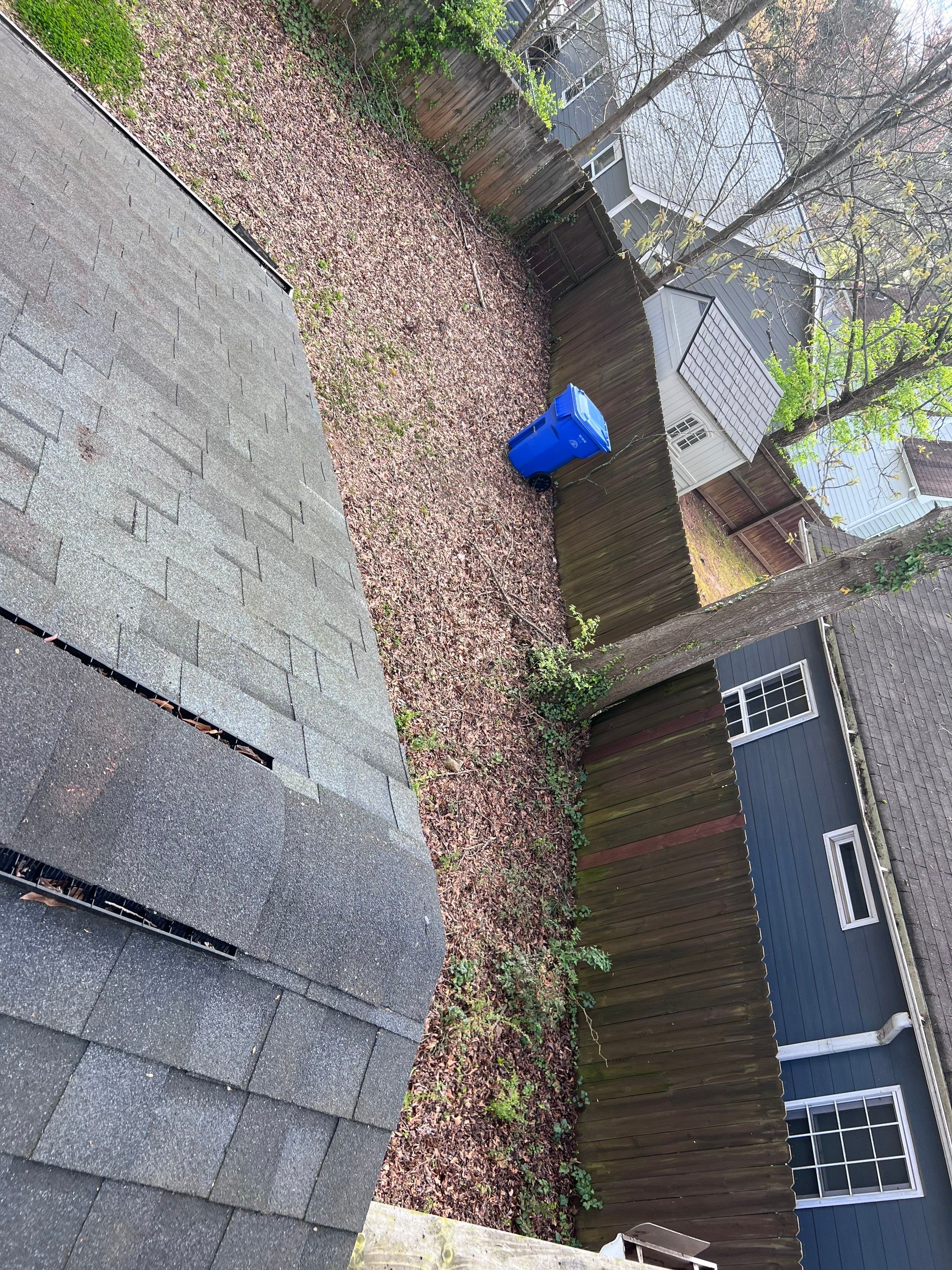 Gutter Cleaning using brown bags by Roof Bullies