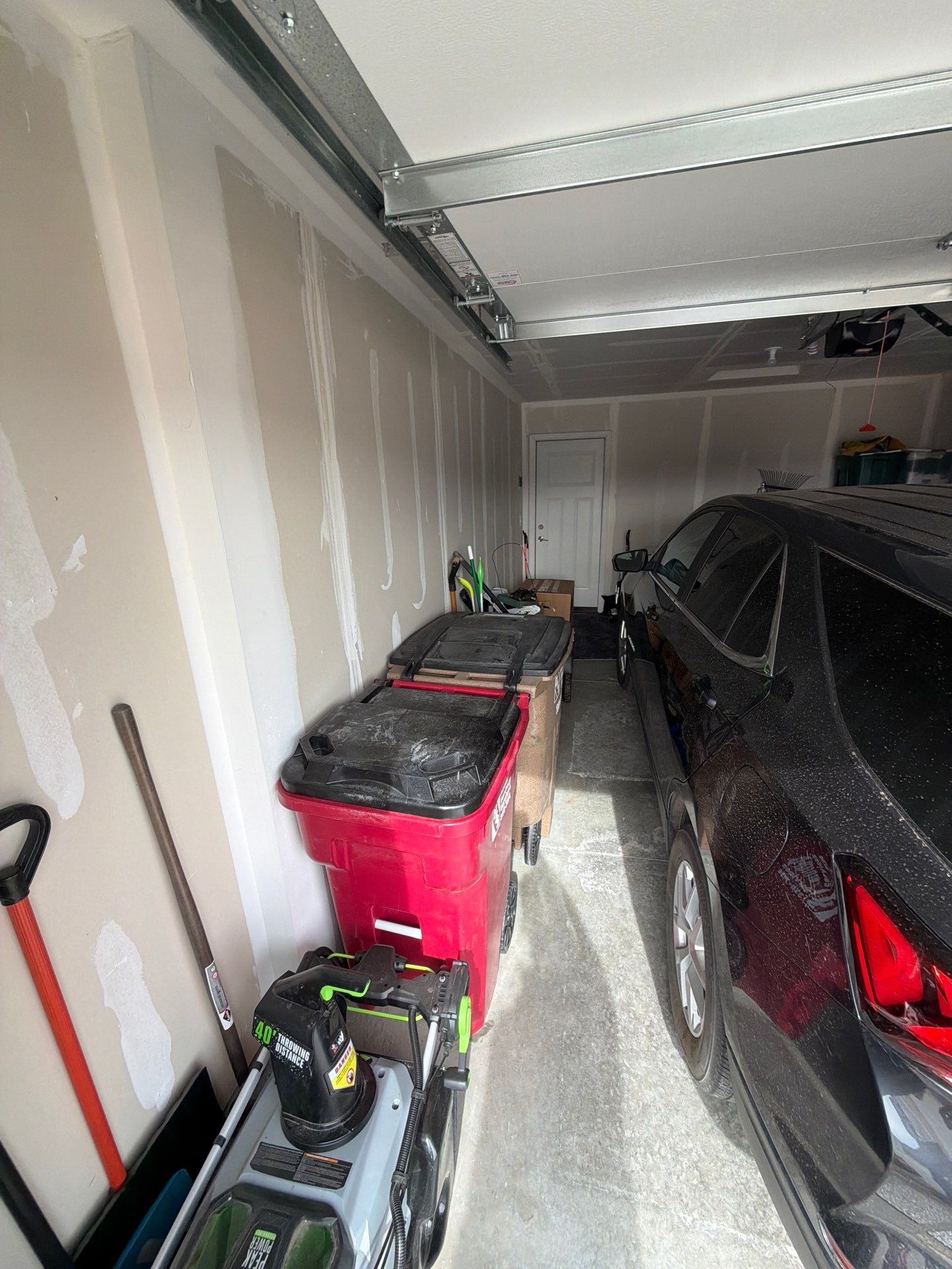 Custom Epoxy Garage Floor Coating Installation in Sioux Falls by Select Painting, Coatings & Garage Cabinets