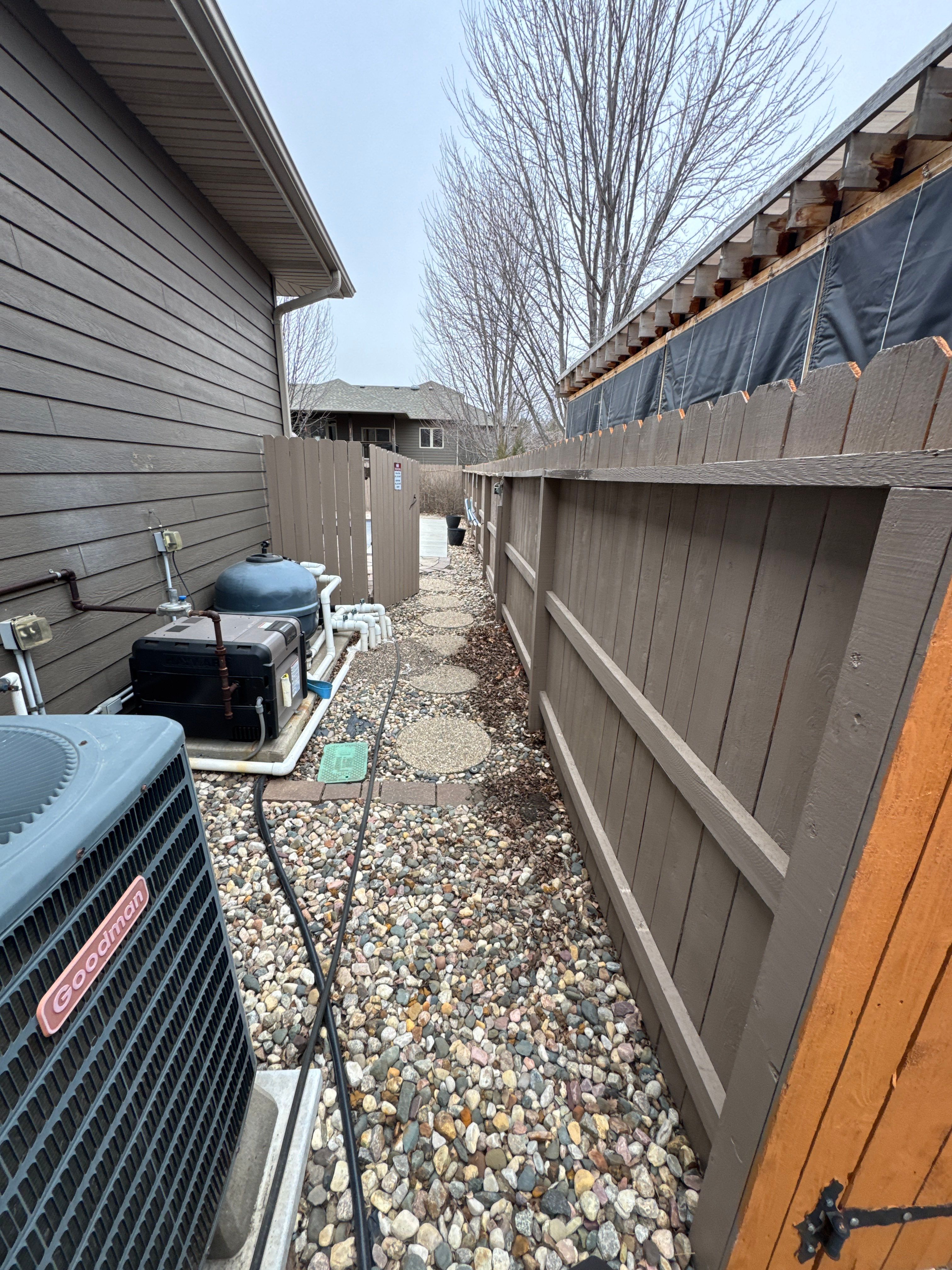 Sioux Falls Residential Exterior Update and Flagstone Pool Deck by Select Painting, Coatings & Garage Cabinets