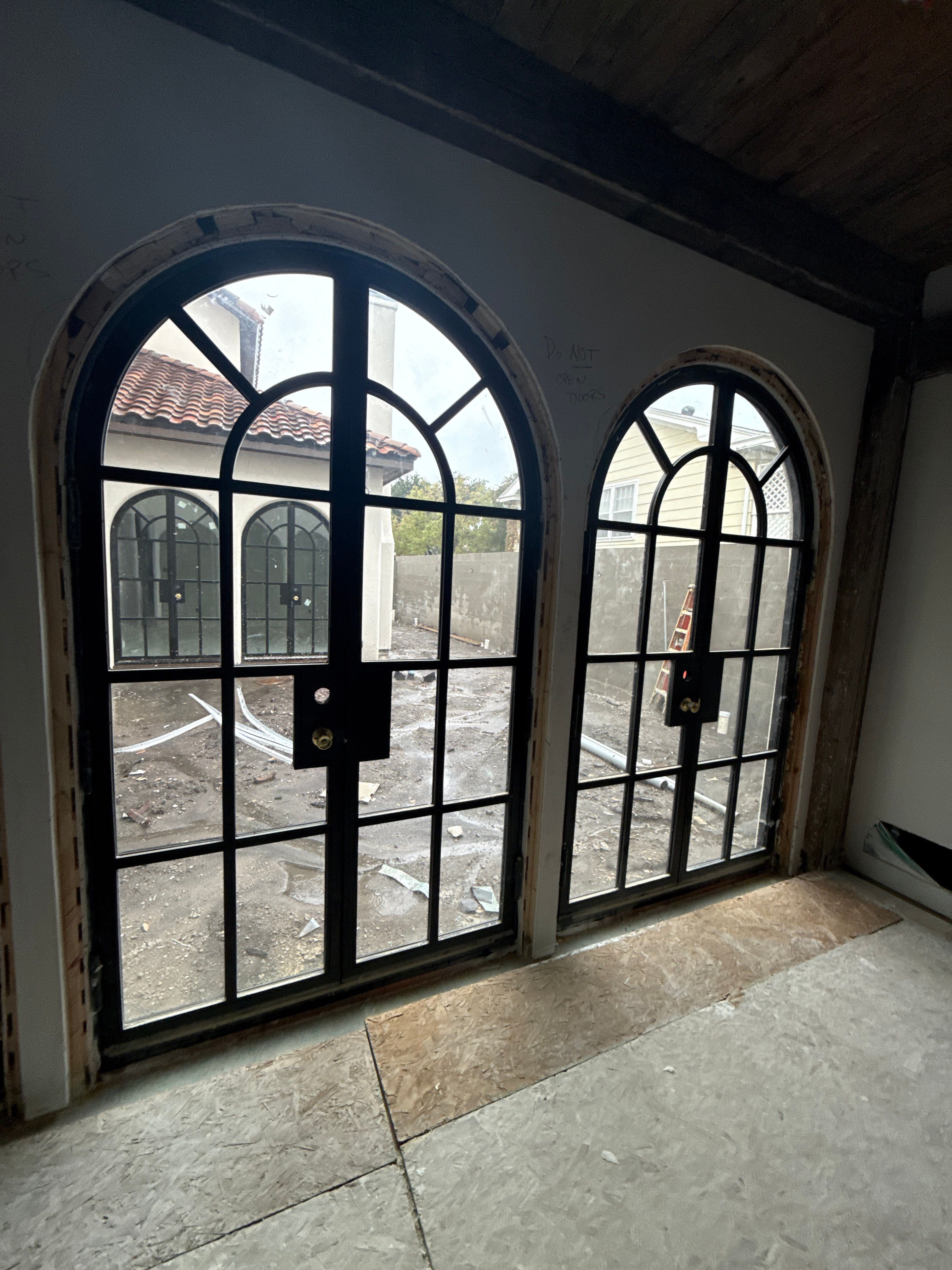 Arched Black Metal French Door Installation and Finishing in Fort Worth by Solara Custom Living