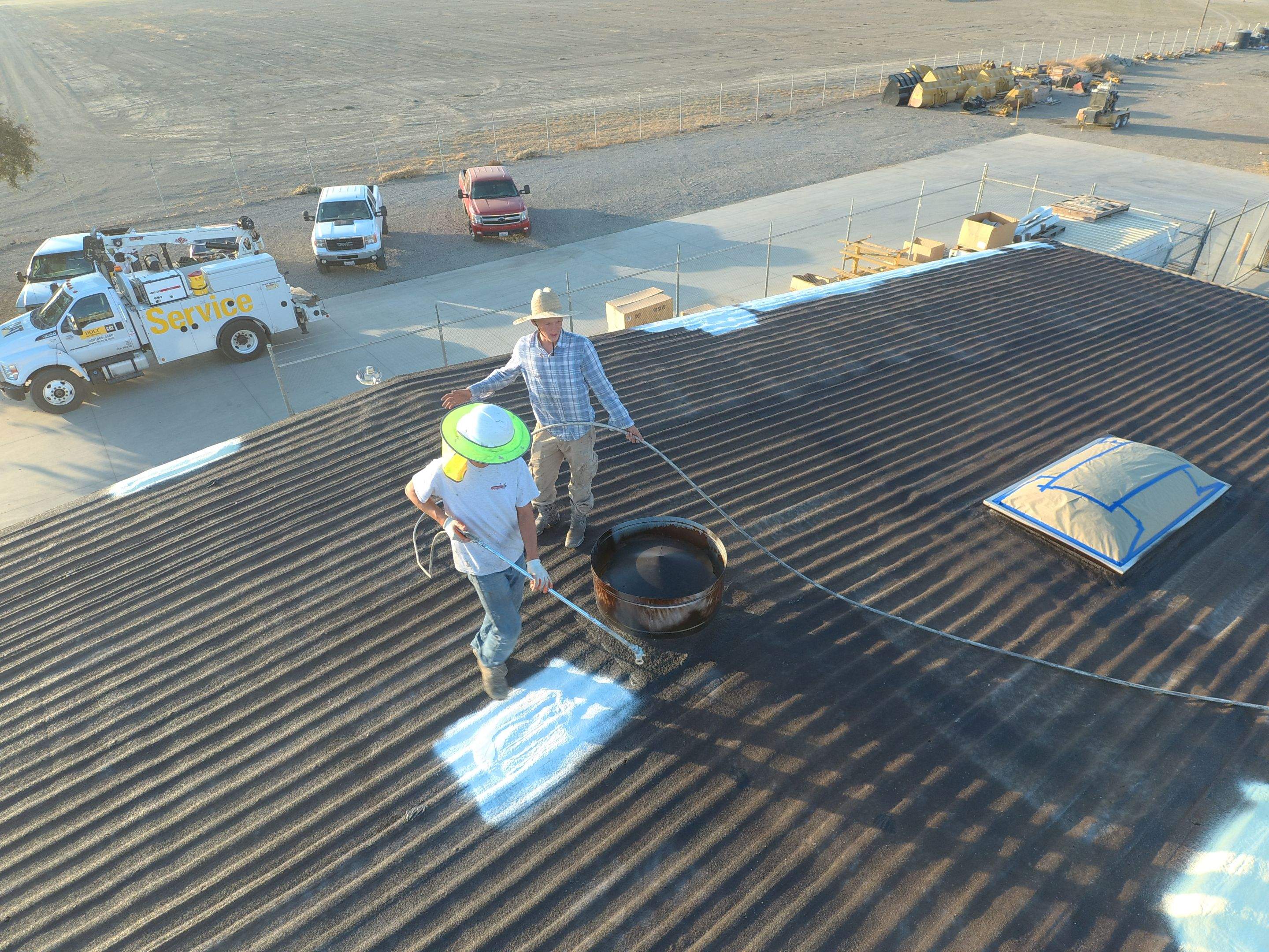Metal roof restoration on commercial roof using Conklin Benchmark/ PUMA XL acrylic coatings over metal and foam by Straight Edge Roofing Inc