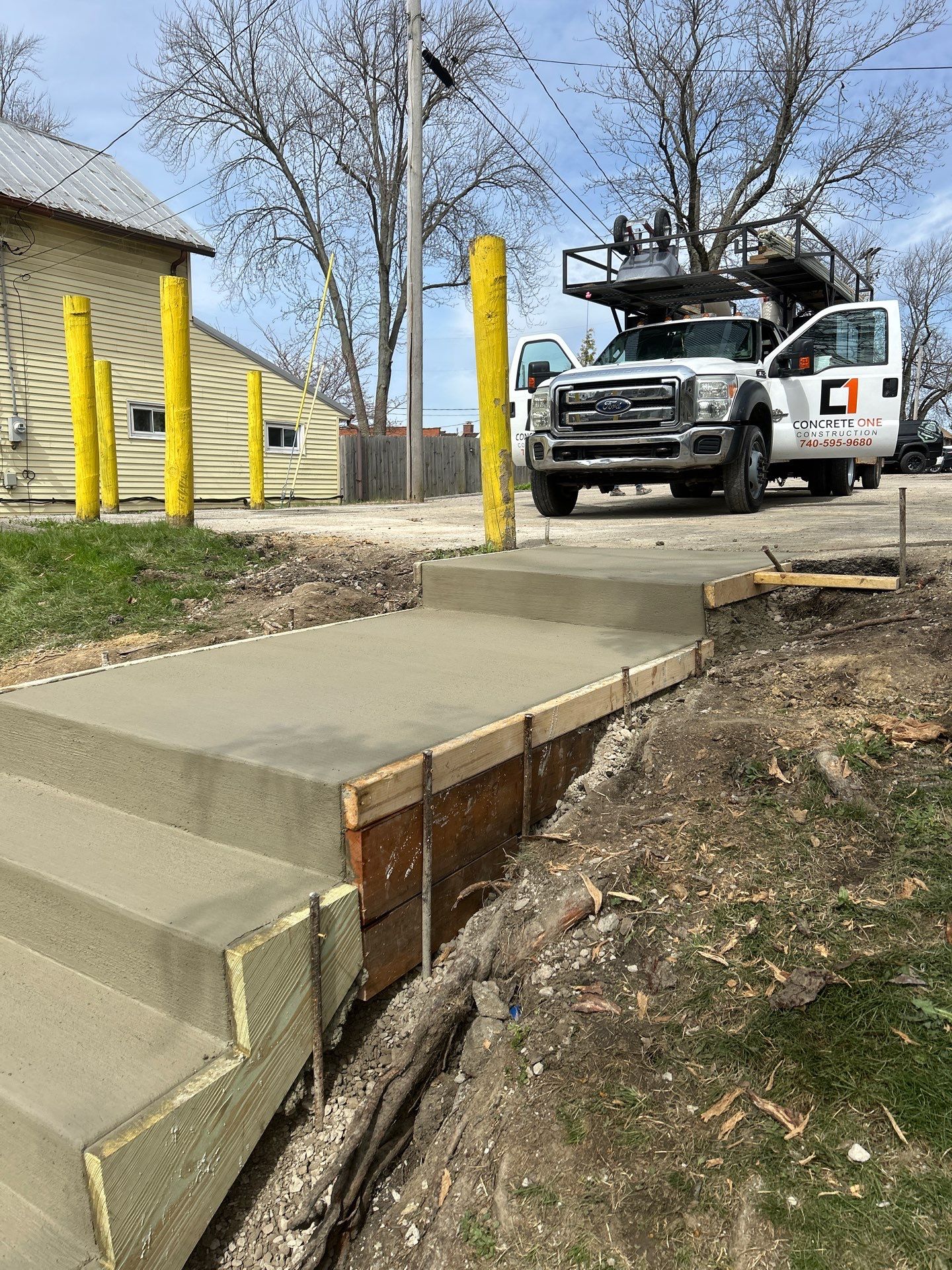 Concrete Staircase and Metal Handrail Installation in Sunbury by Concrete One Construction