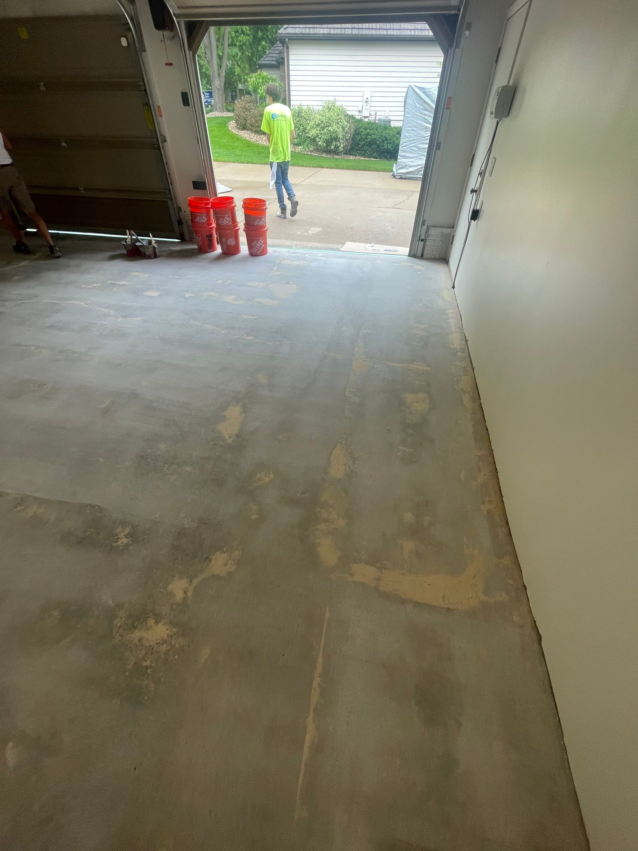 Gray Speckled Epoxy Garage Floor Coating in Sioux Falls by Select Painting, Coatings & Garage Cabinets