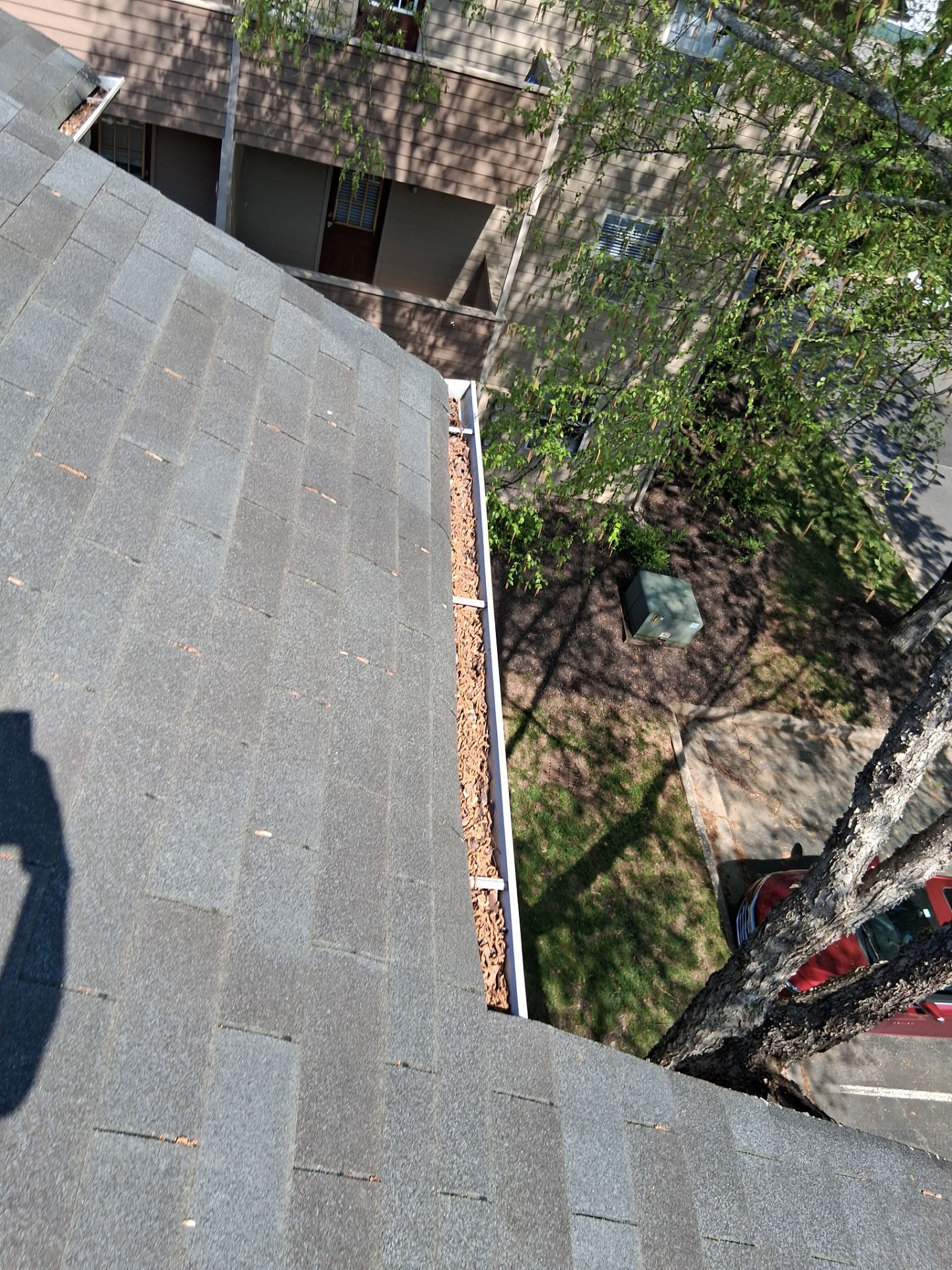HOA gutter cleaning in Mooresville & Lake Norman, NC,before  photo showing full gutters.