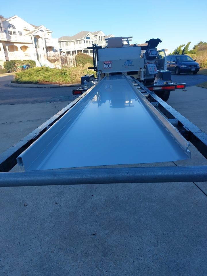 Large Metal Roof Transformation by Gallop Roofing & Remodeling, Inc.