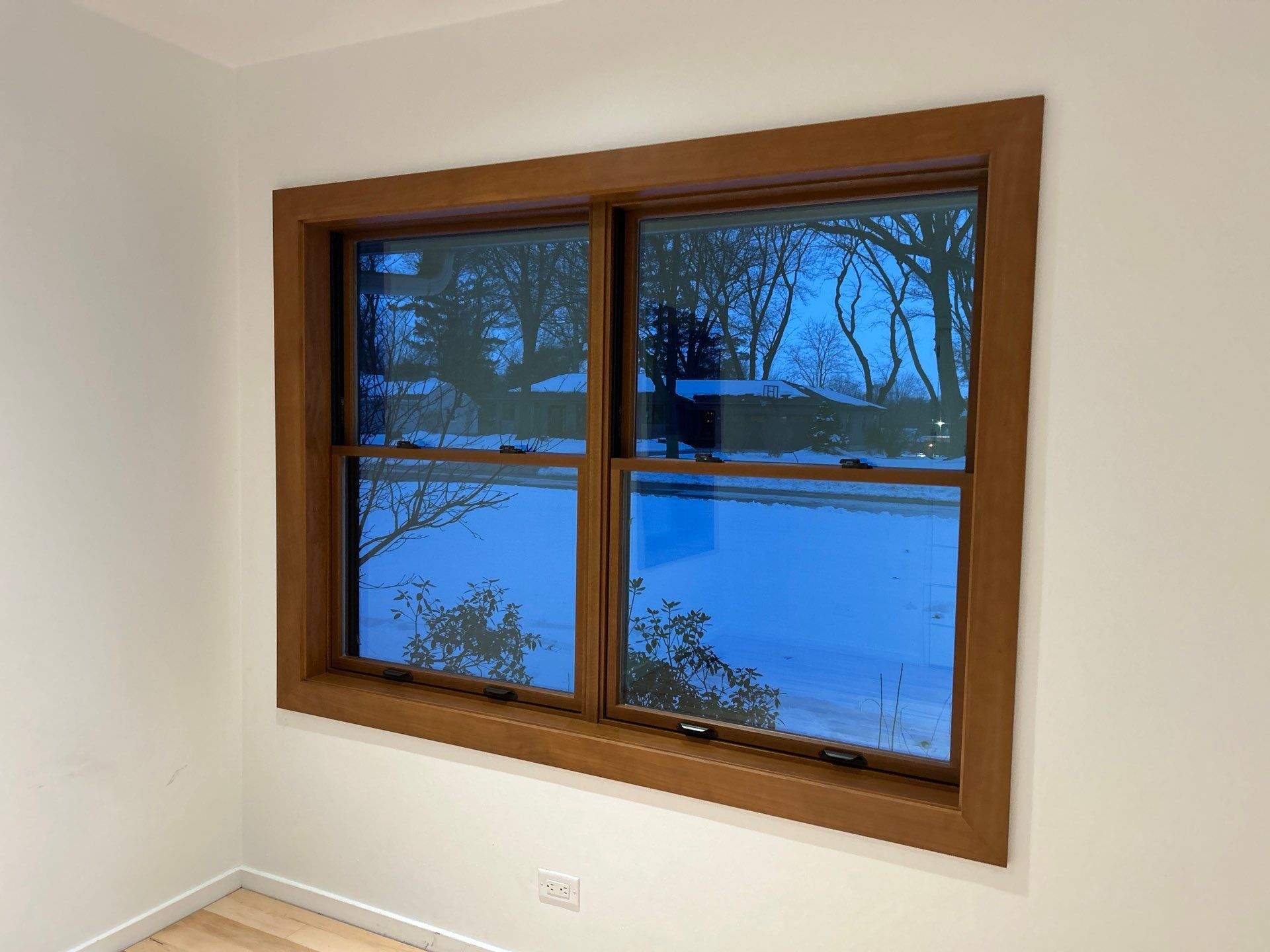 Black-Frame Pella Lifestyle Upgrade on a Partial Brick Home by United Windows and Siding LLC