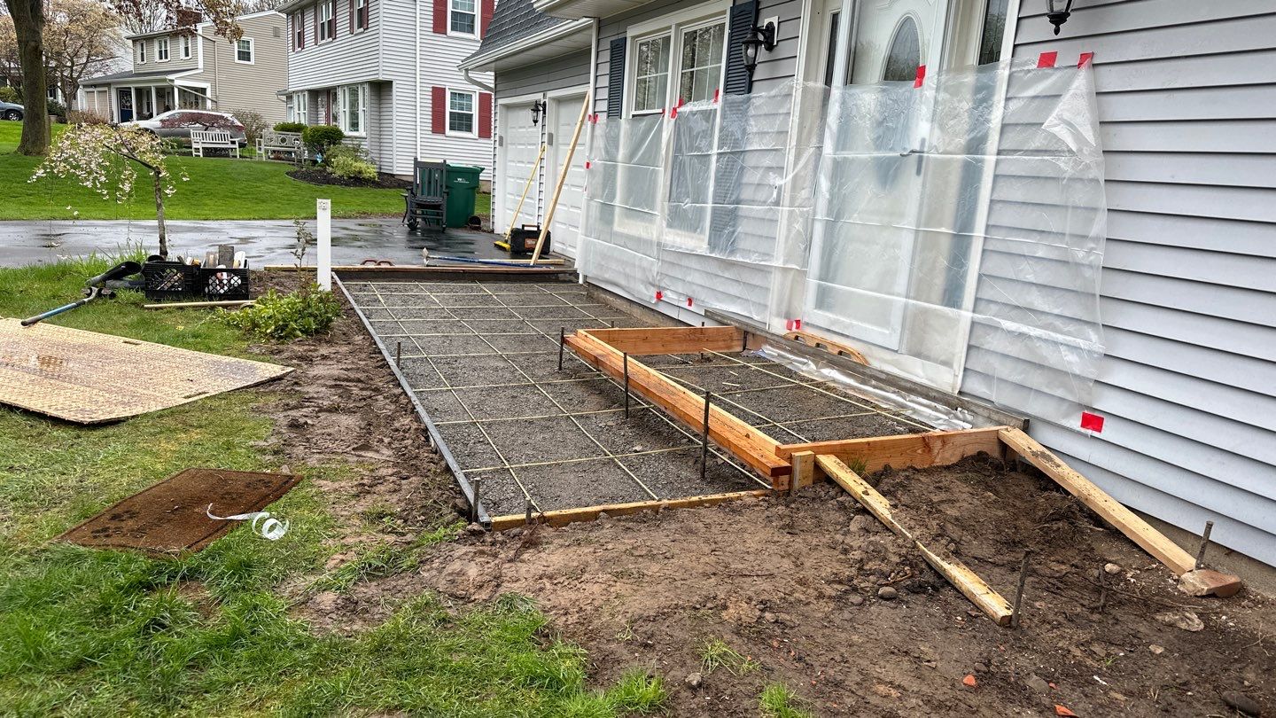 Broom finished front patio  by NG Masonry & Construction LLC