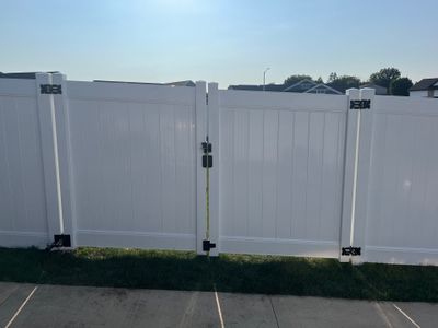 White Vinyl Privacy Fence Installation With Double Gates in Waterloo
