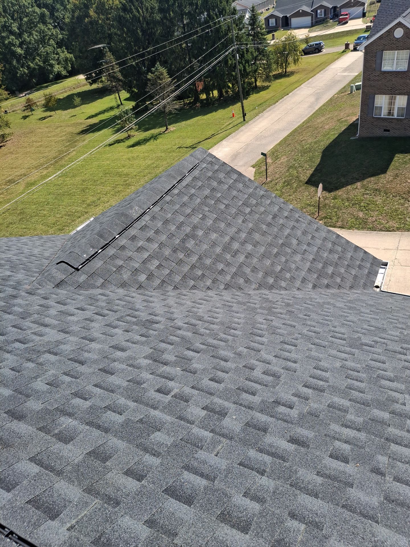 Residential Roofing Installation using GAF Timberline HDZ Charcoal by Rainstoppers Roofing