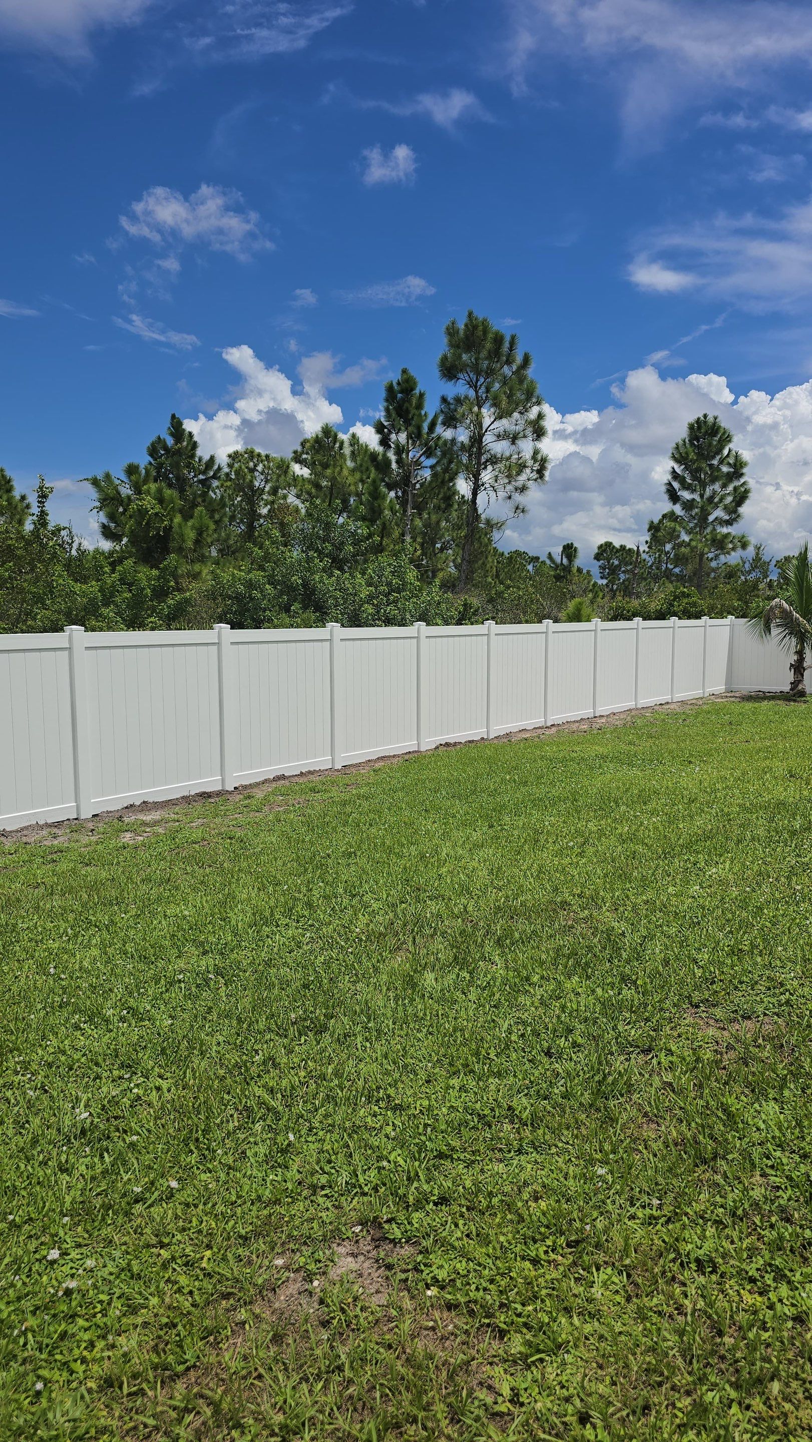 White Vinyl Privacy Fence Installation in Port Charlotte Florida by True Fence LLC