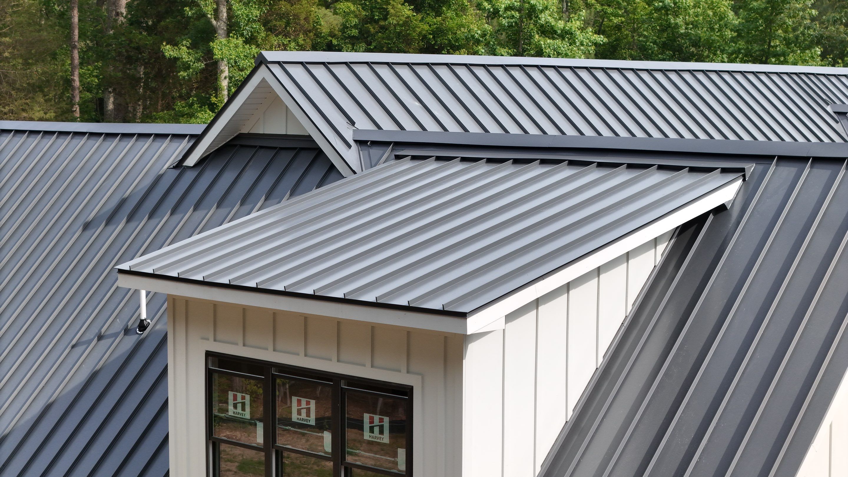 Custom New Construction Home Featuring Standing Seam Metal Roofing in Port Haywood by Cade Construction