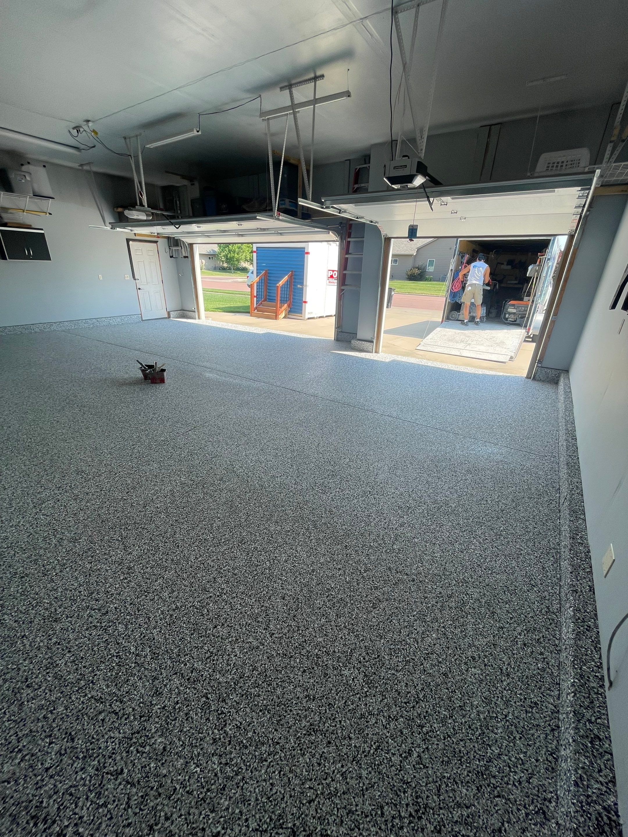 Sioux Falls Garage Concrete Coating Installation with Domino Flake by Select Painting, Coatings & Garage Cabinets