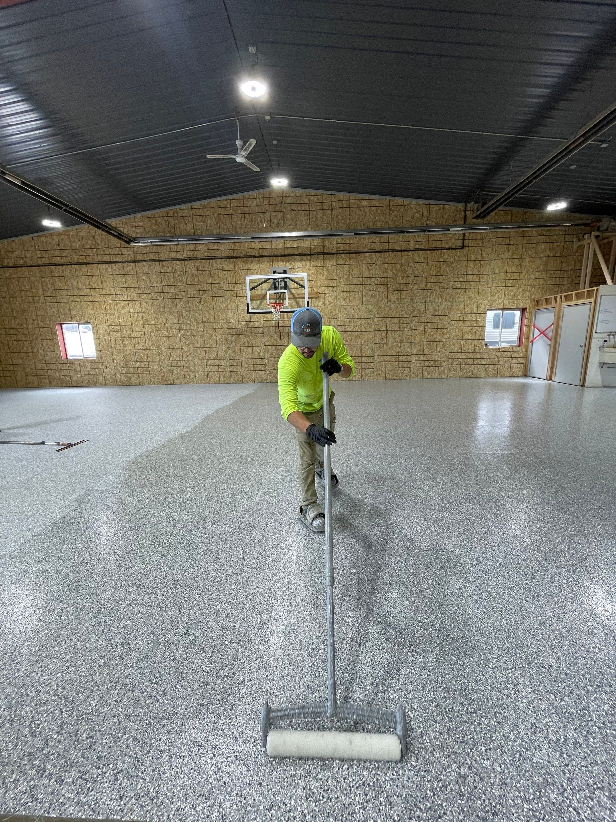 Custom Polyurea Shop Floor with Basketball Court Lines in Rock Valley by Select Painting, Coatings & Garage Cabinets