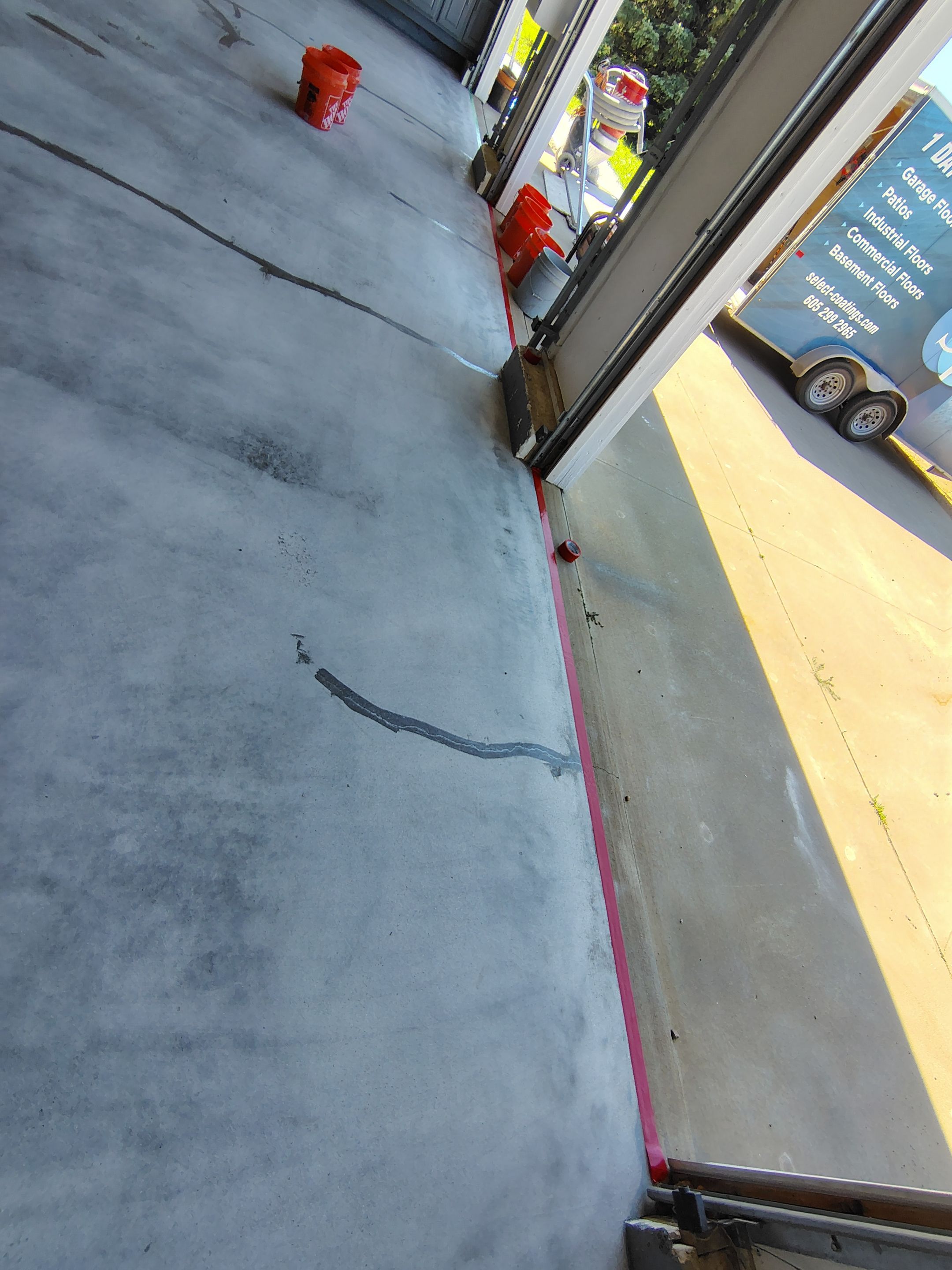 Feather Grey Garage Floor Coating Installation in Valley Springs by Select Painting, Coatings & Garage Cabinets
