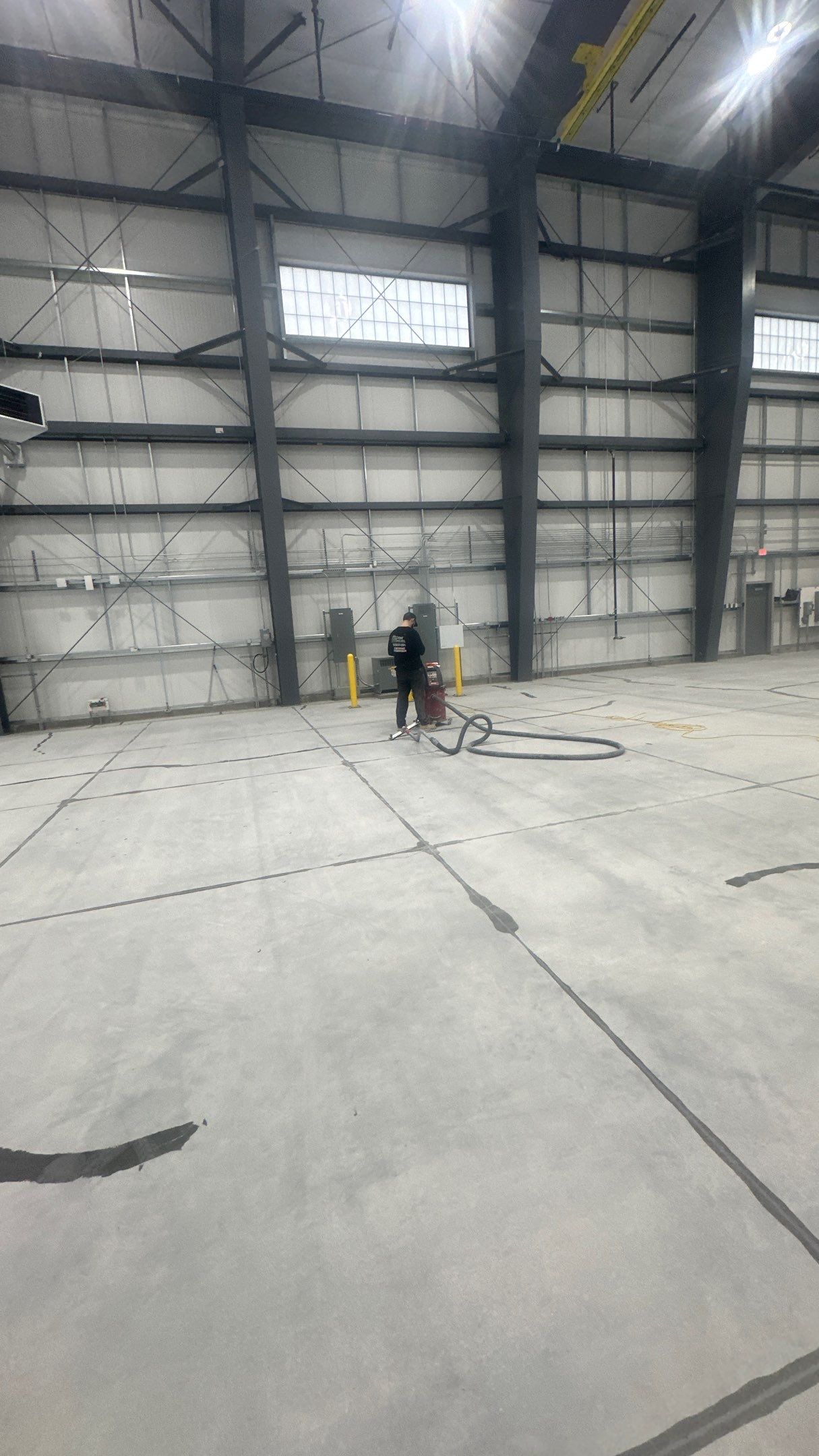 Airplane Hanger using Light Grey Commercial Penntek Epoxy by Croc Coatings, LLC