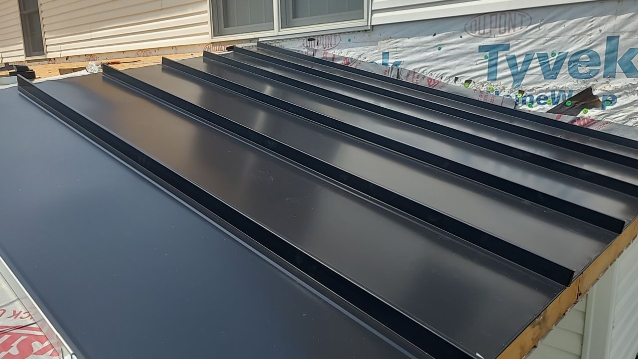 Roof Damage using Certainteed Lifetime Roofing System- Moire Black Landmark Pro shingkes with shadow ridge caps. by BulletpROOF Exteriors