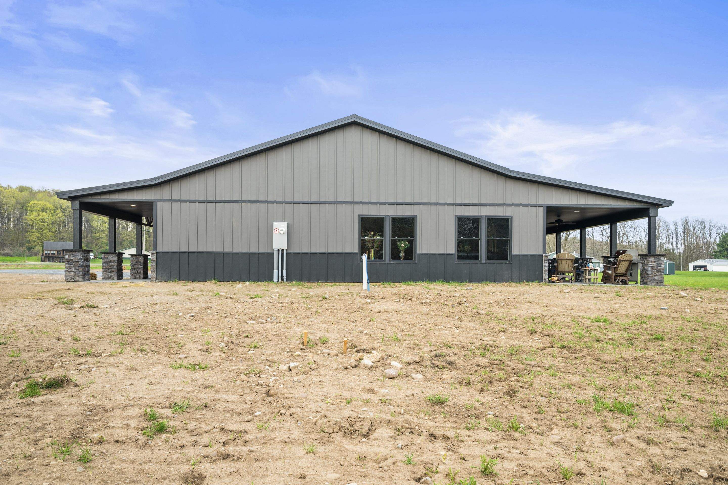Barndominium  using Textured Board & Batton by Horst Custom Homes 