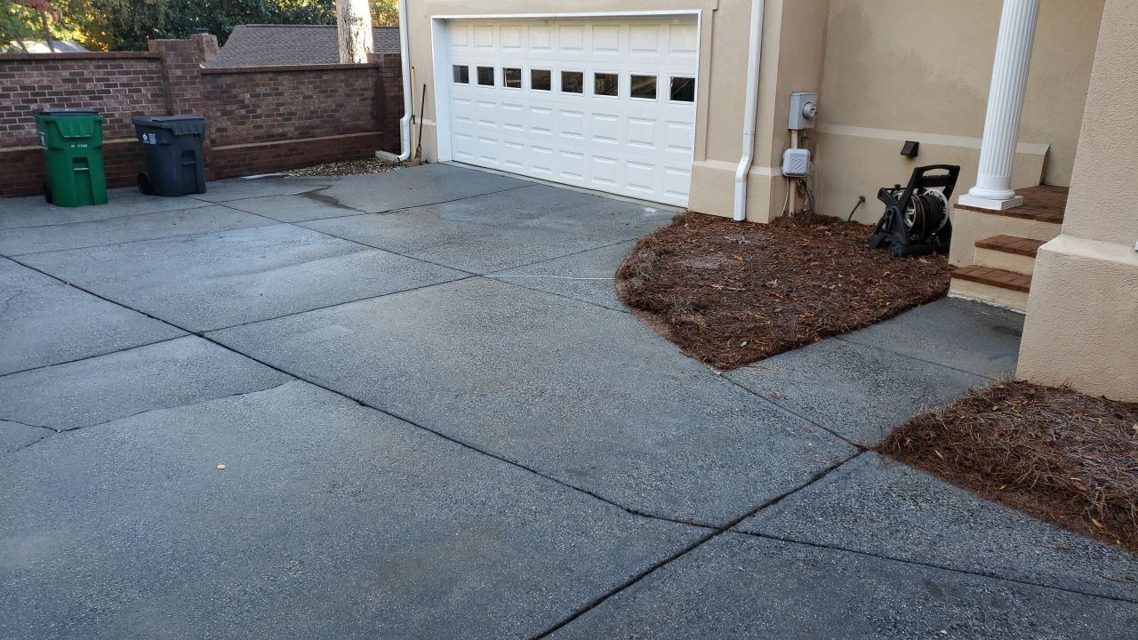 Driveway Clean using cleaner by Power Wash Masters LLC