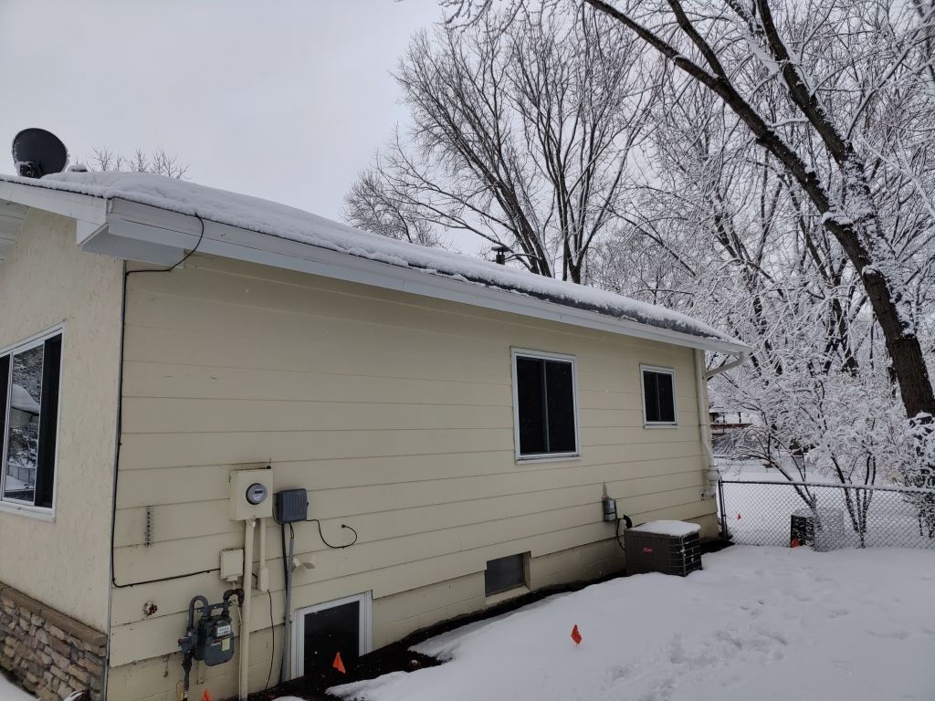 Ice Dam Steaming in Maple Grove by Next Level Seamless Gutters / Exteriors Inc.