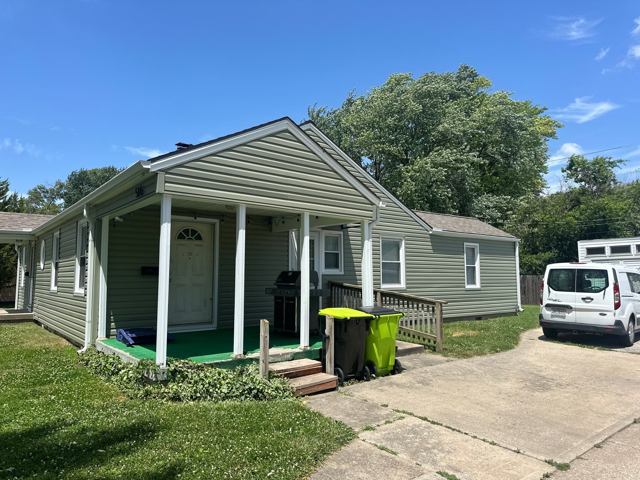 New Cypress Siding going on this North Kansas City Home  by EEC  Windows, Siding & Roofing 