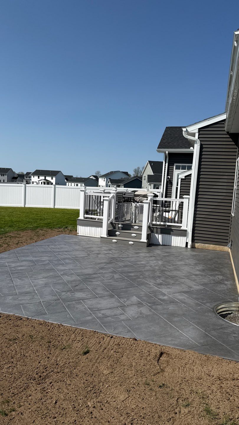 Majestic Ashlar stamped concrete patio  by NG Masonry & Construction LLC