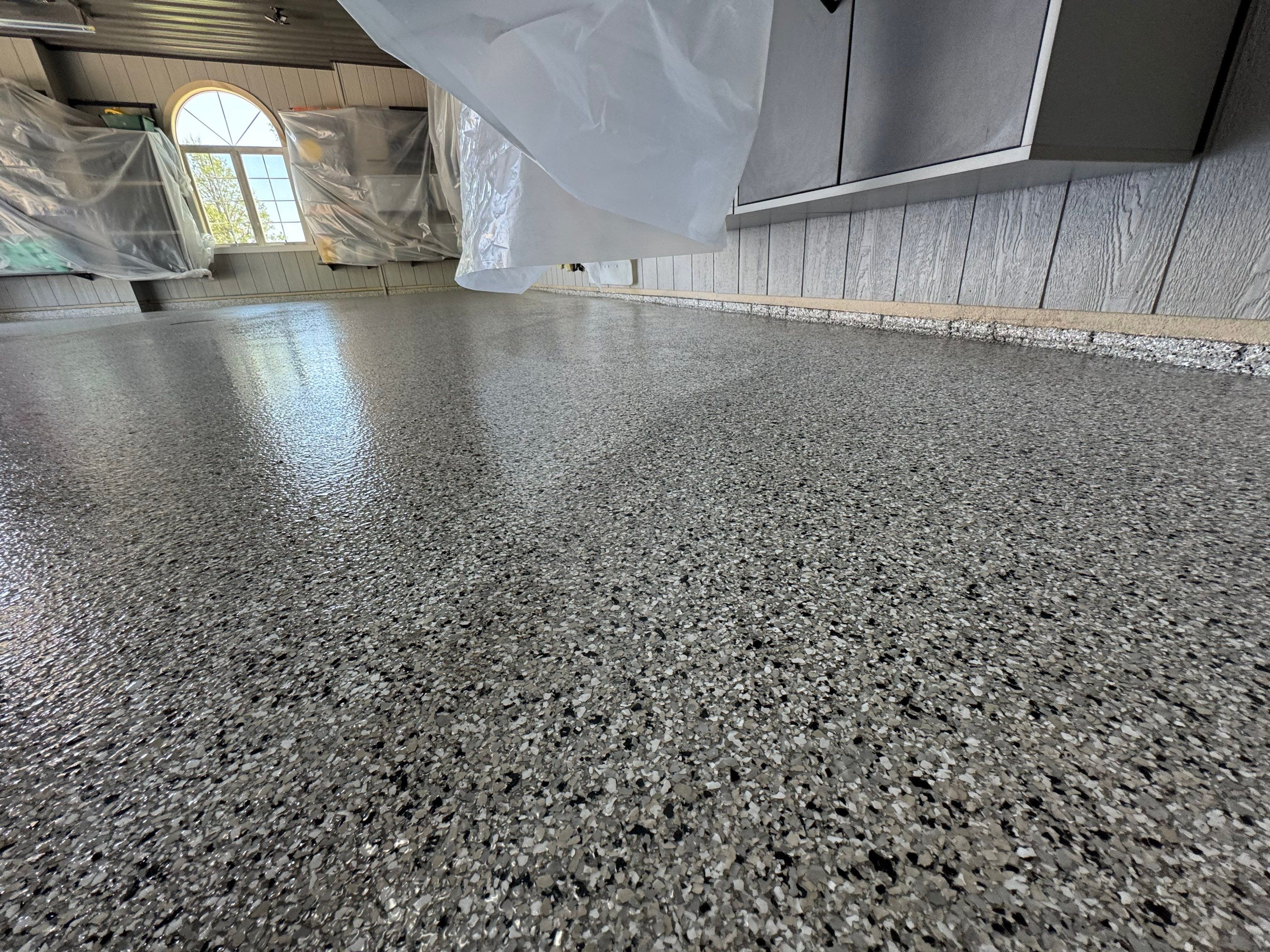 High-Gloss Grey Epoxy Floor Coating for Inwood Garage by Select Painting, Coatings & Garage Cabinets