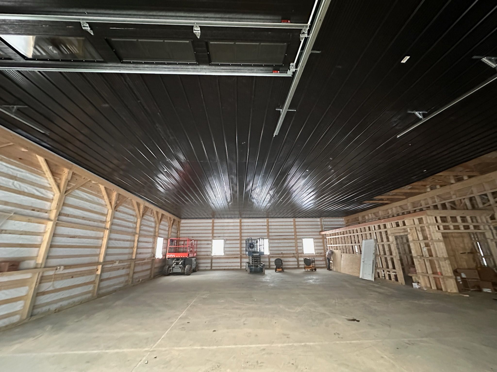Barndominium  using Textured Board & Batton by Horst Custom Homes 