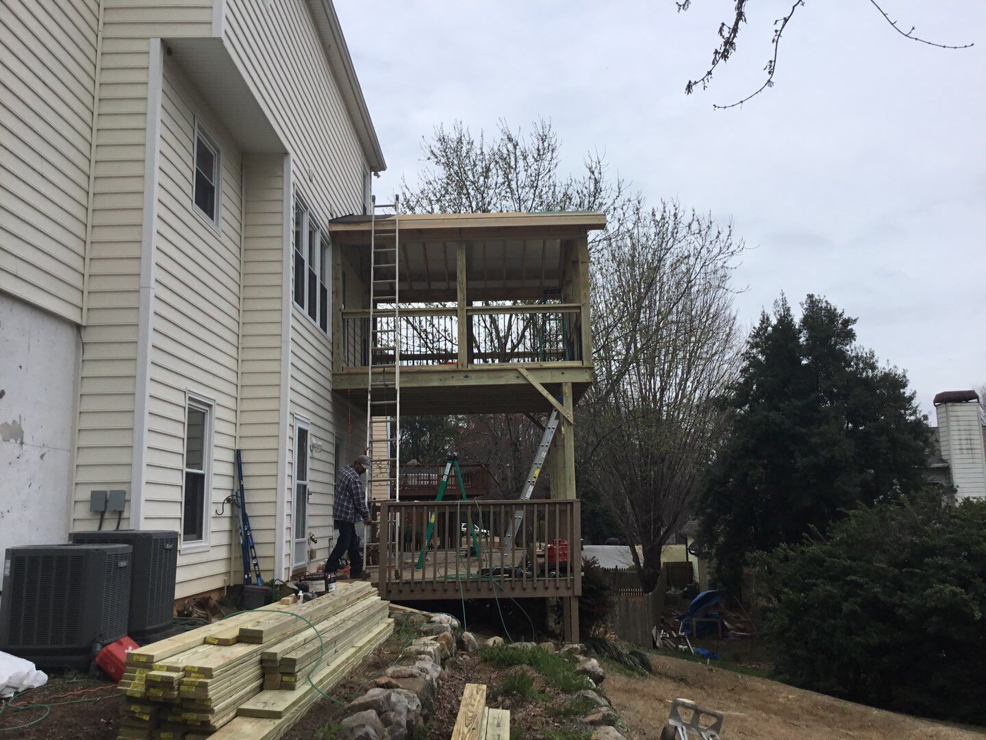 Two-Story Pressure Treated Wood Deck and Porch Addition in Marietta by Swift Home Renovations