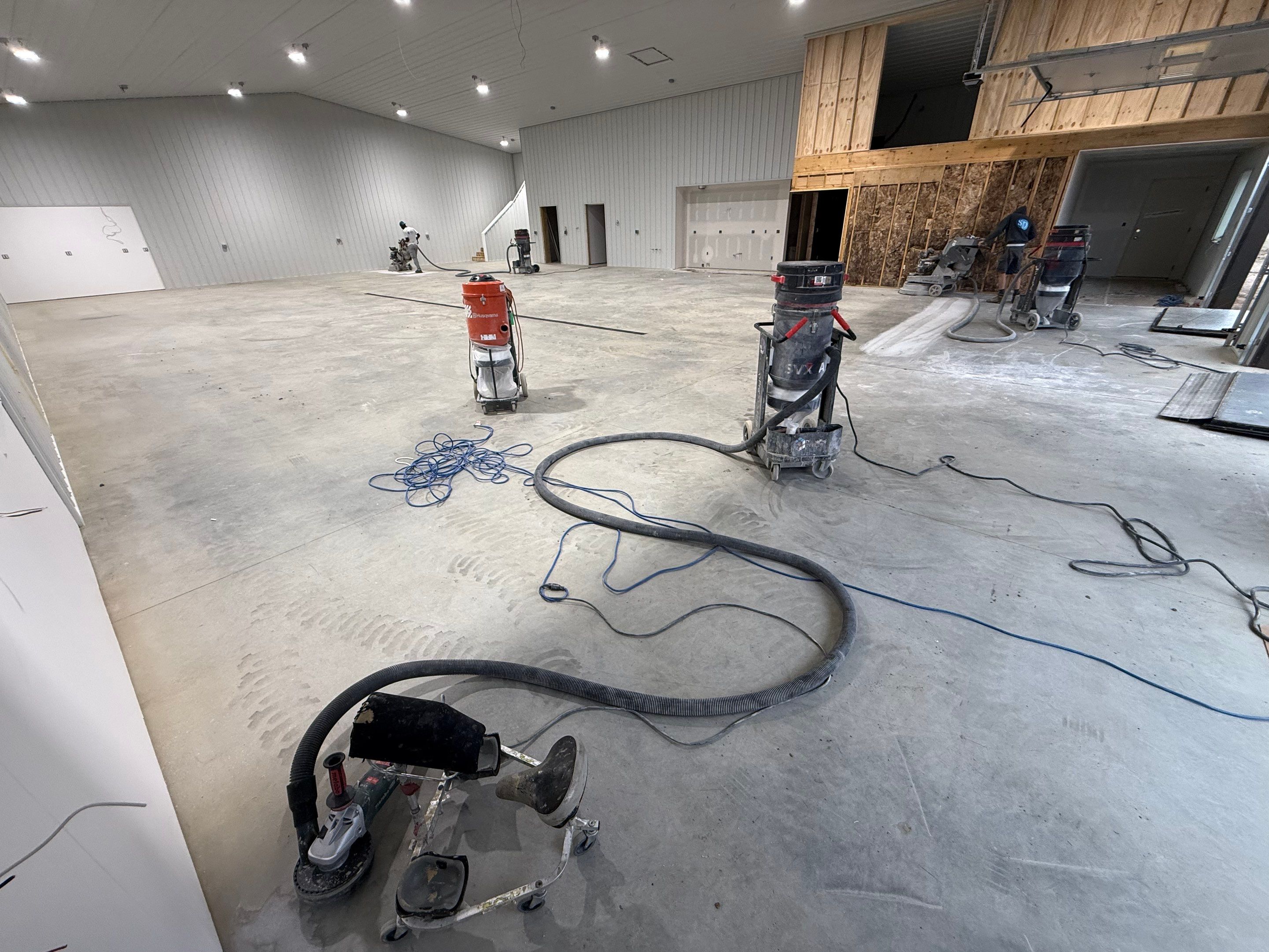 Custom Speckled Floor Coating for Large Montrose Shop by Select Painting, Coatings & Garage Cabinets
