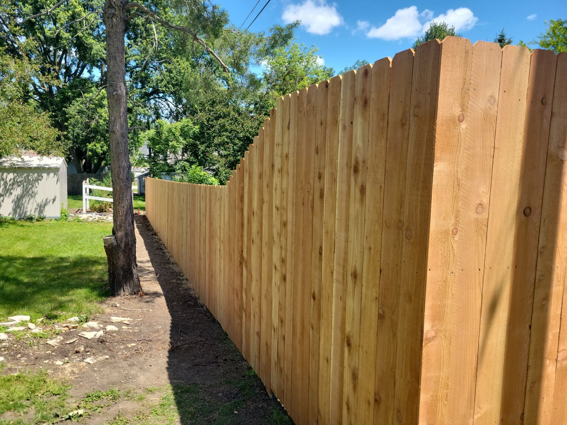 Custom Cedar Unstained Wood Privacy Fence Installation in Cedar Falls by Perfect Picket Fence and Stain