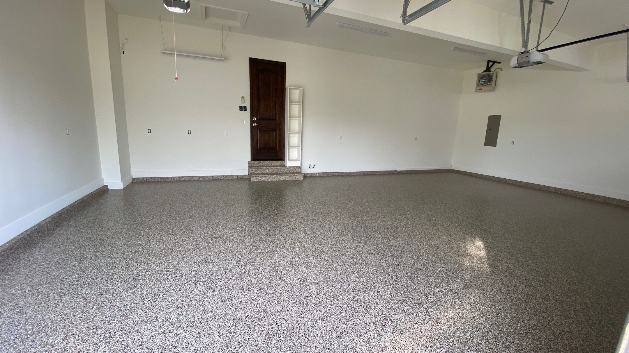 Kenny & Debbie transformed their garage with a Banner Garage Floor and cabinets by Banner Garage