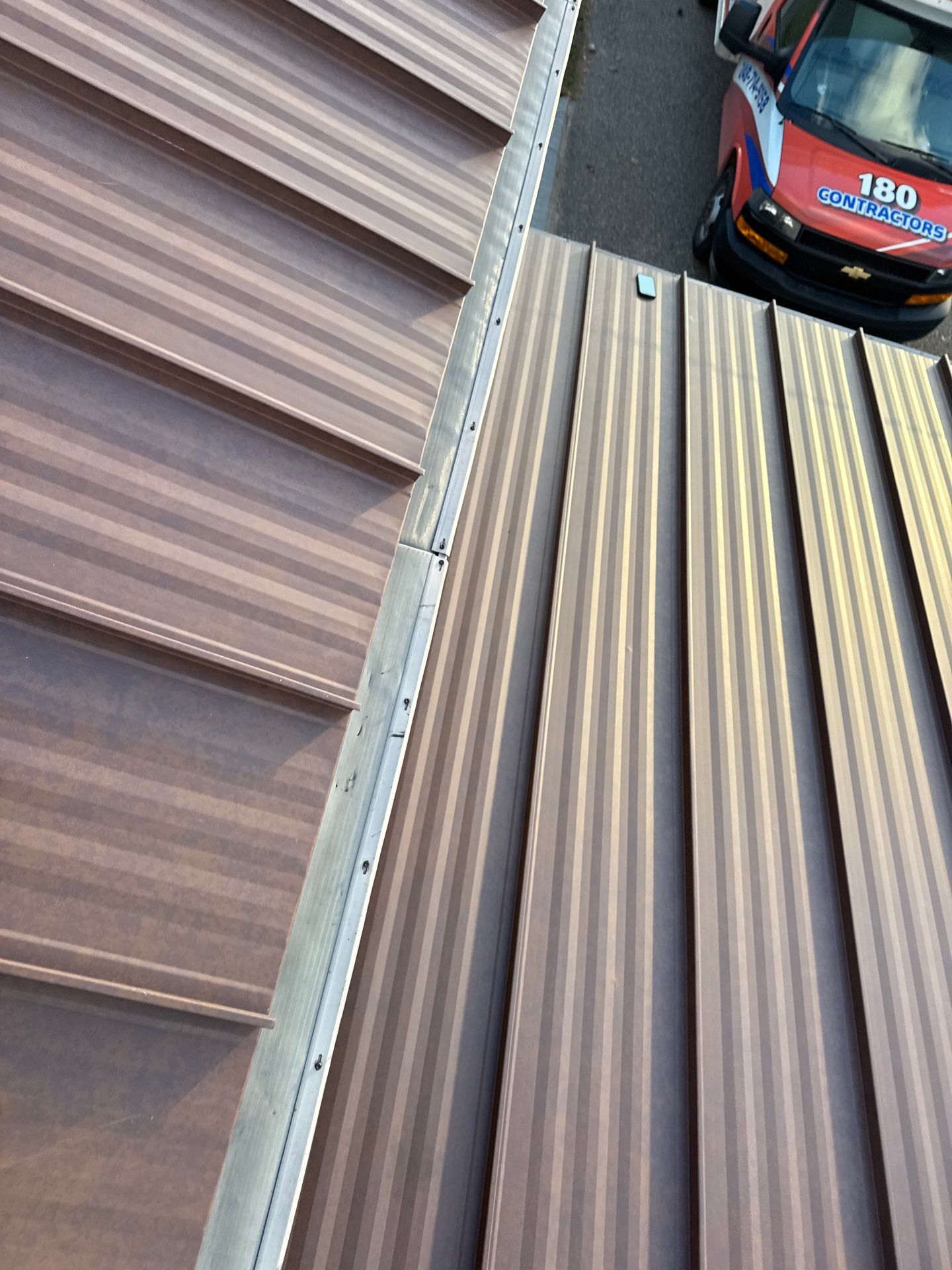 Roof Replacement using MS Standing Seam Roof Western Rust by 180 Contractors