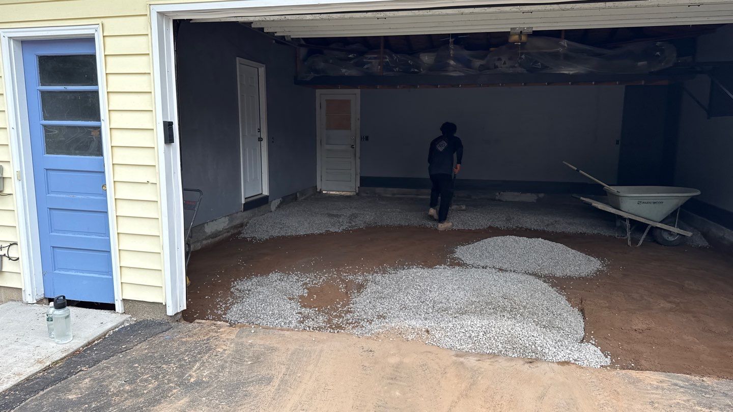 Concrete garage floor replacement and epoxy coating installed by NG Masonry & Construction LLC