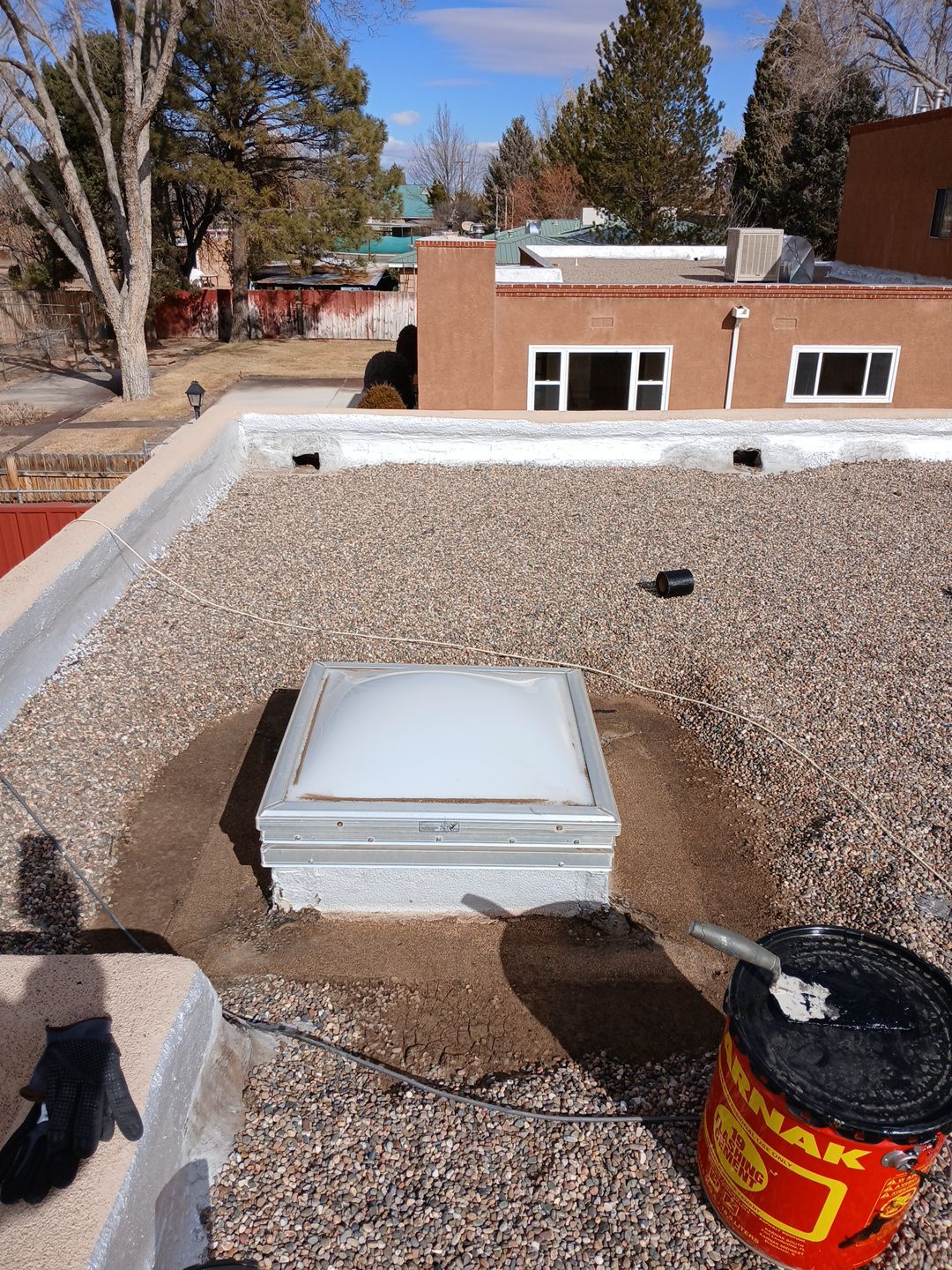 Roof Maintenance and Low-E Tempered Glass Skylight Replacement on Gravel Roof in Northwest Albuquerque by Doyle Roof Masters Inc